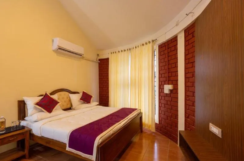 Bed in KSTDC Hotel Mayura Krishna Almatti