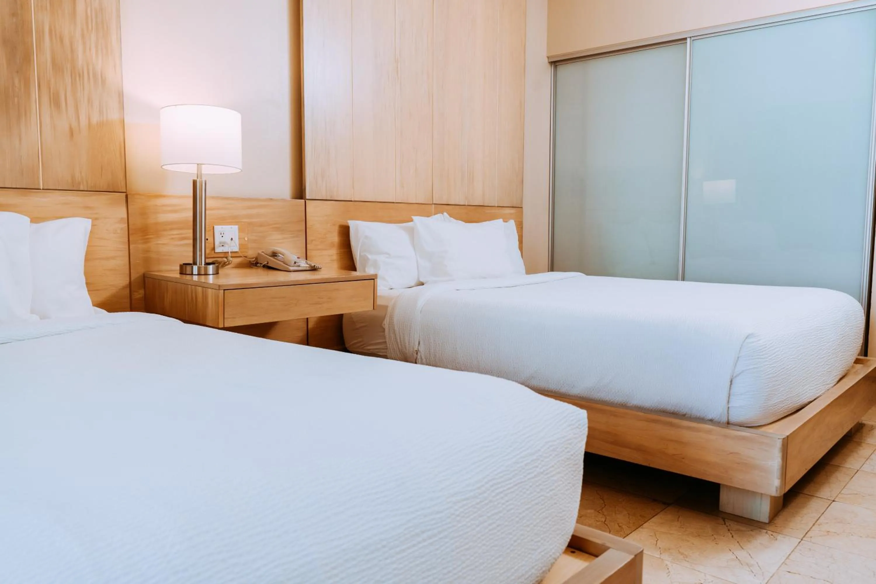 Bed in The Mill Resort and Suites