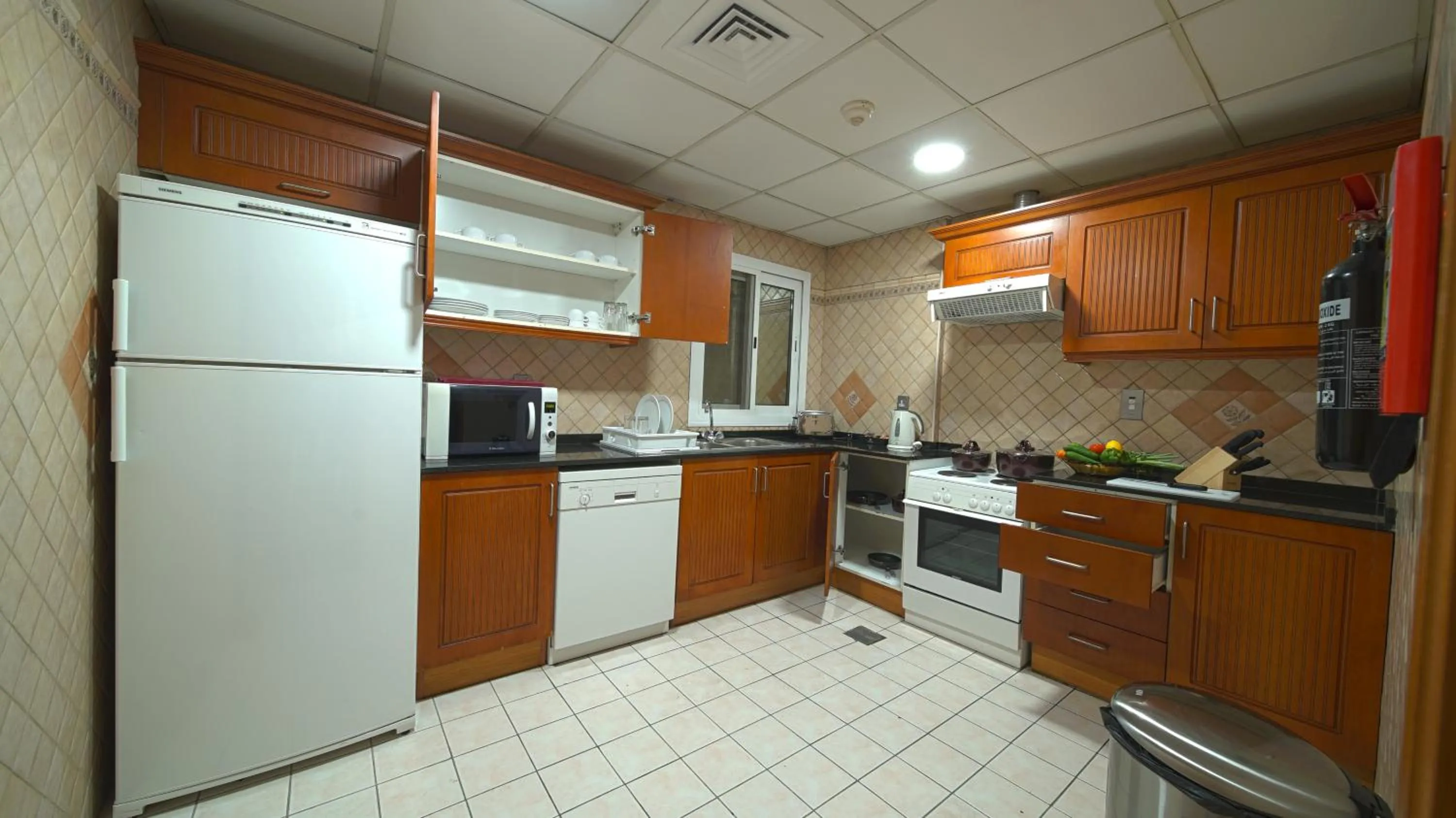 Kitchen or kitchenette in Rose Garden Hotel Apartments - Bur Dubai