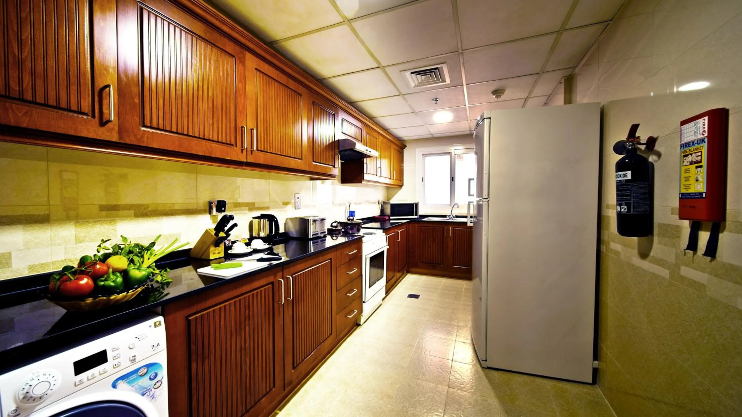 Kitchen or kitchenette in Rose Garden Hotel Apartments - Bur Dubai