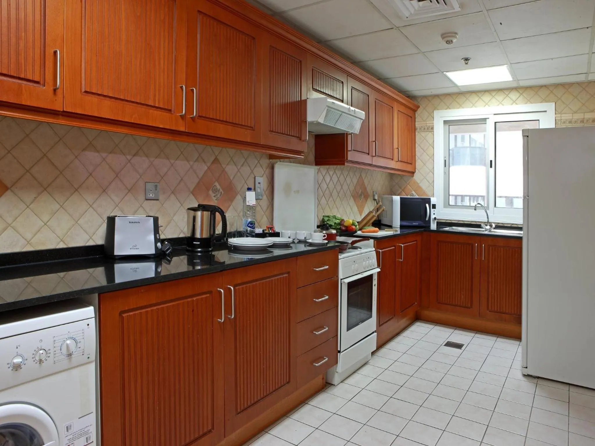 Kitchen or kitchenette in Rose Garden Hotel Apartments - Bur Dubai