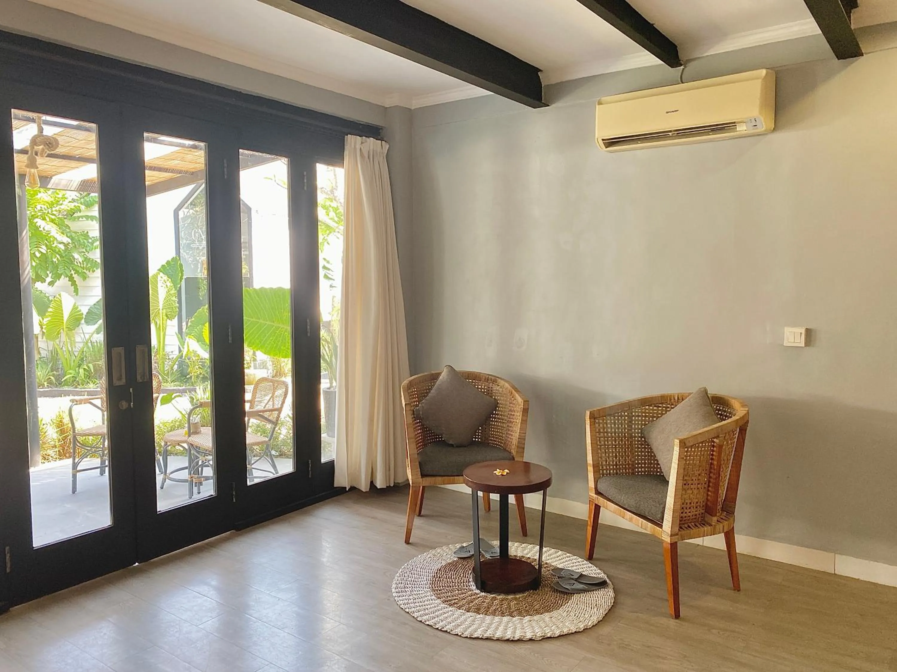 Seating area in The Jungle Hostel Canggu