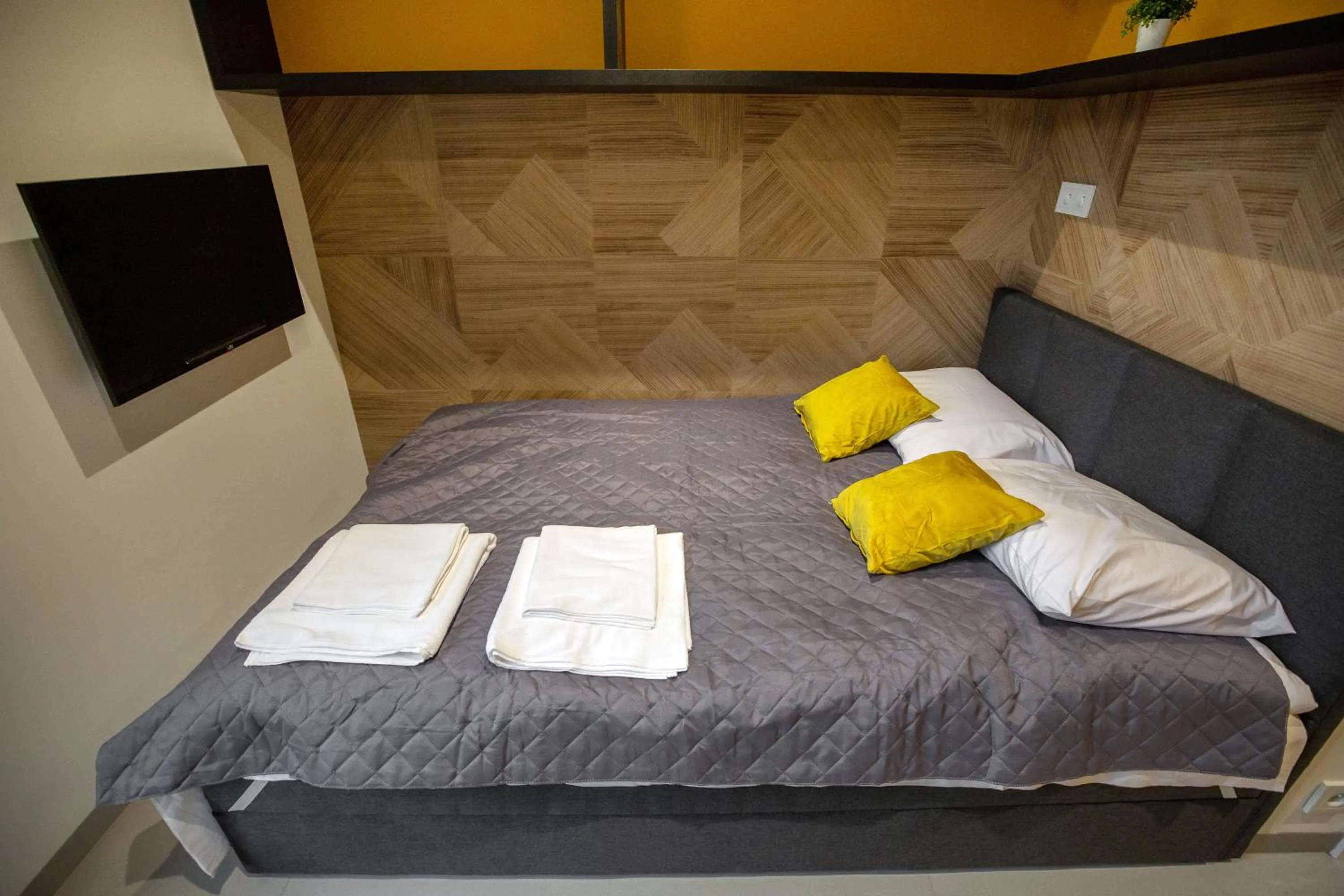 Photo of the whole room, Bed in iroom