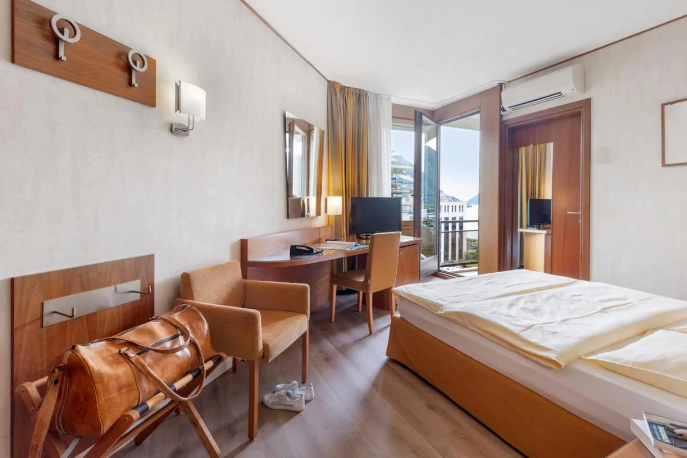 Bed in Hotel Delfino Lugano