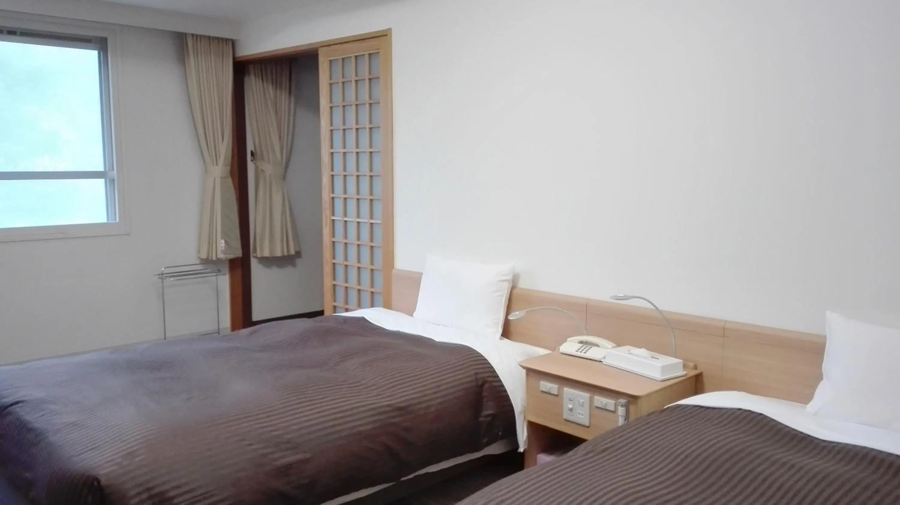 Bed in Hotel Mahoroba