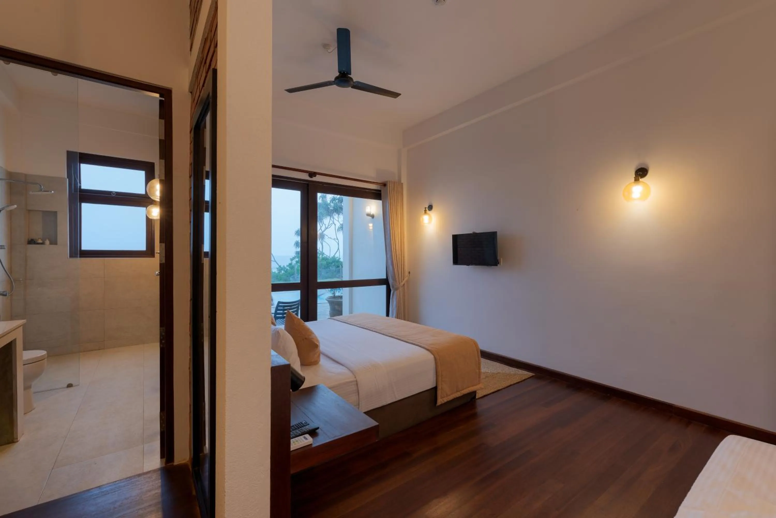 Bathroom, Bed in Bungalow By The Beach