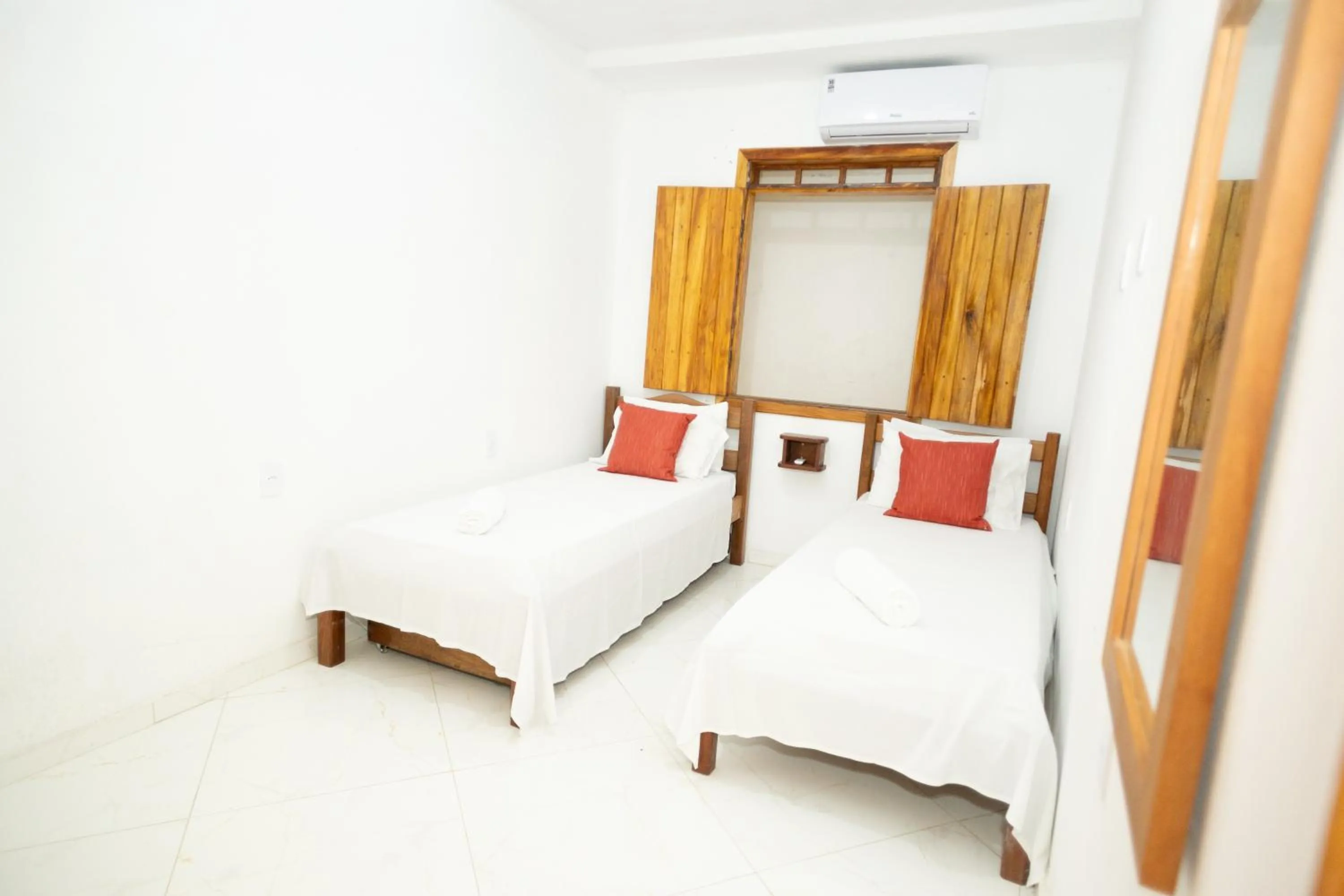 Bed in Pousada Flor do Arraial