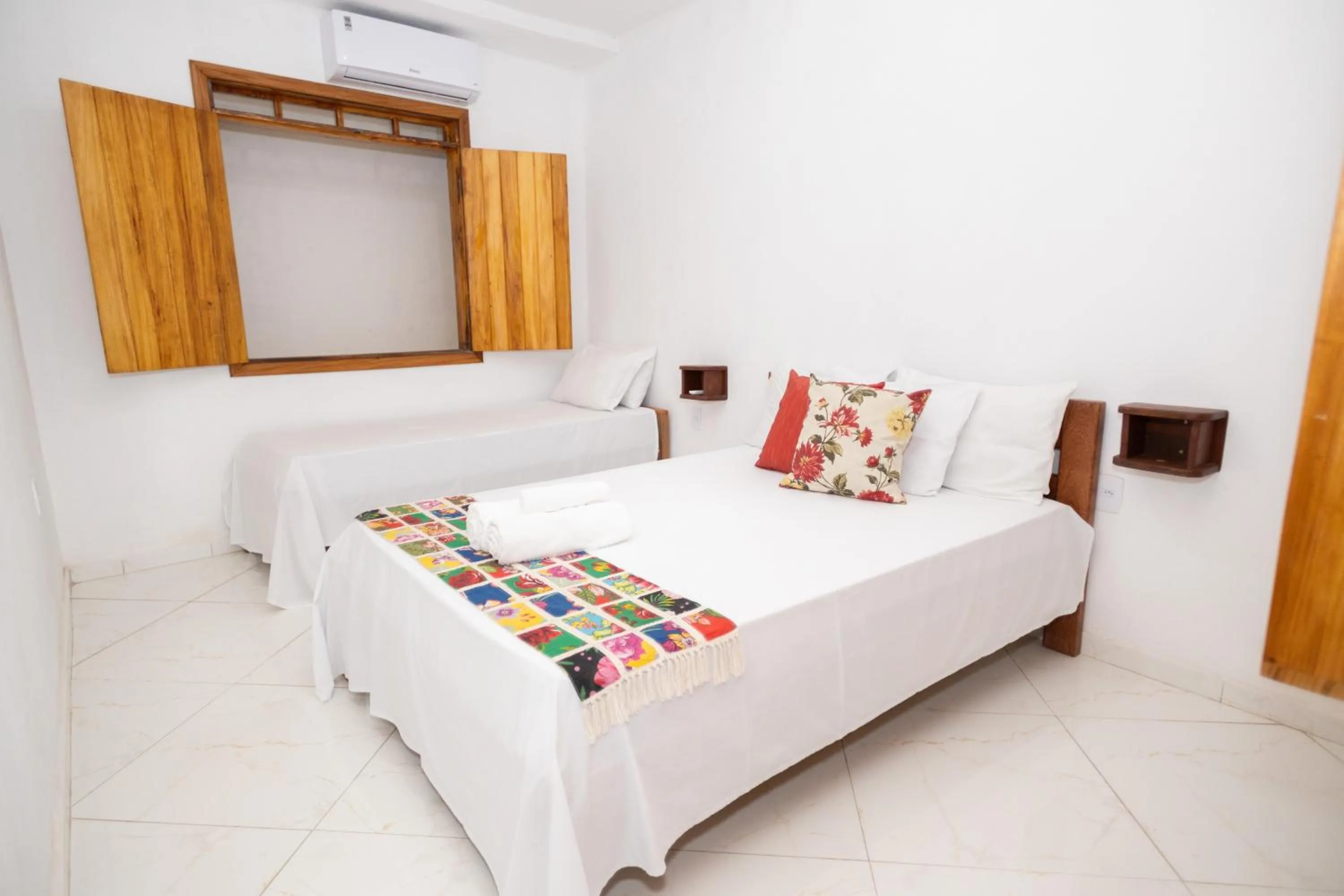 Bed in Pousada Flor do Arraial