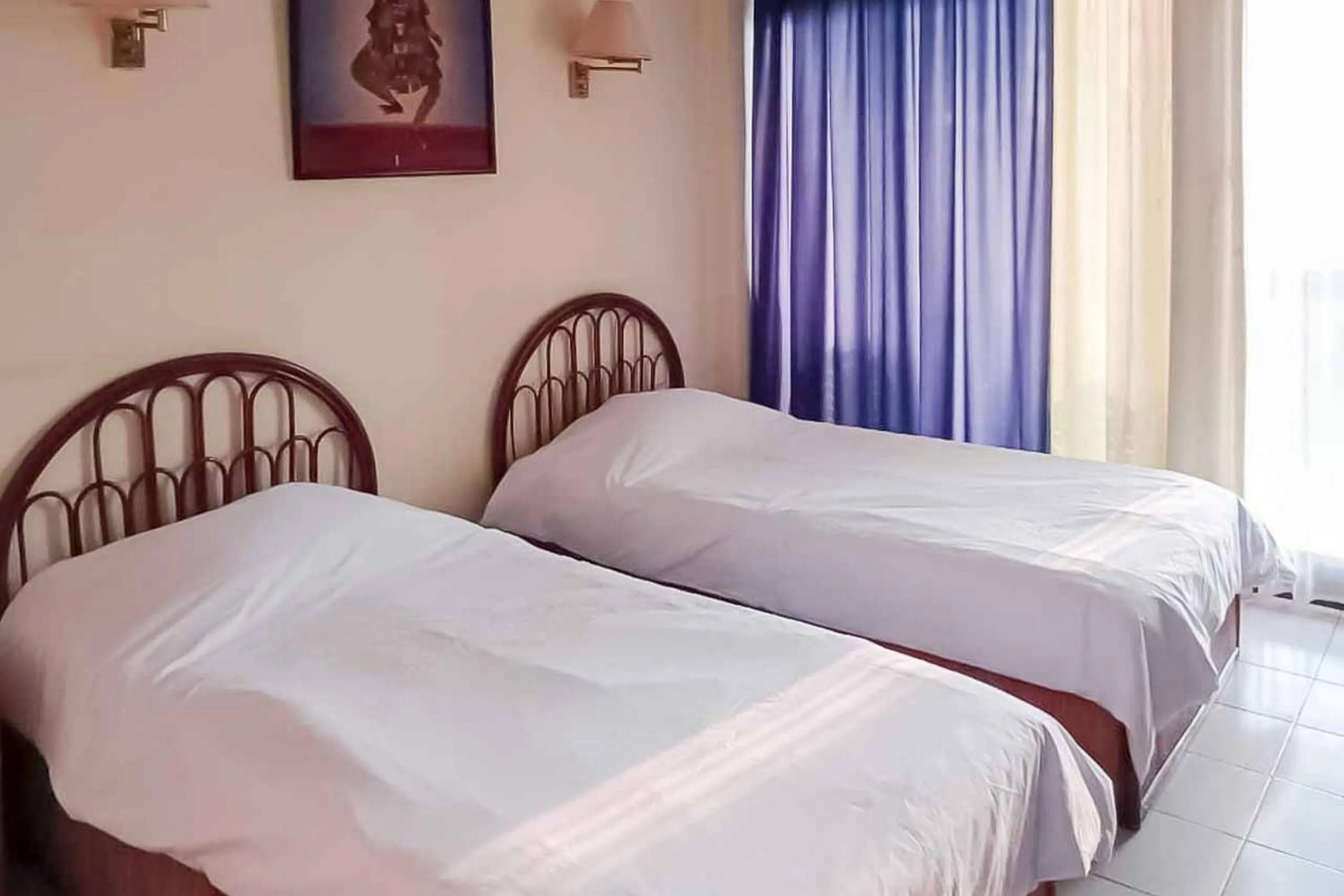 Bed in RedDoorz Plus near Tugu Mercusuar Anyer