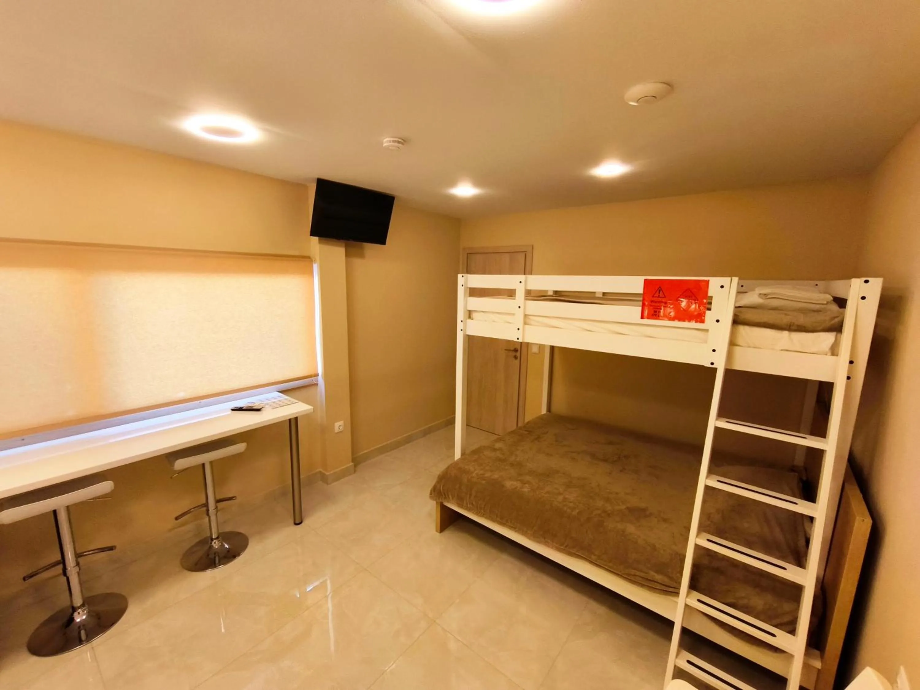 Seating area, Bed in Modular Bungalows With Heated Pool Artemis Greece