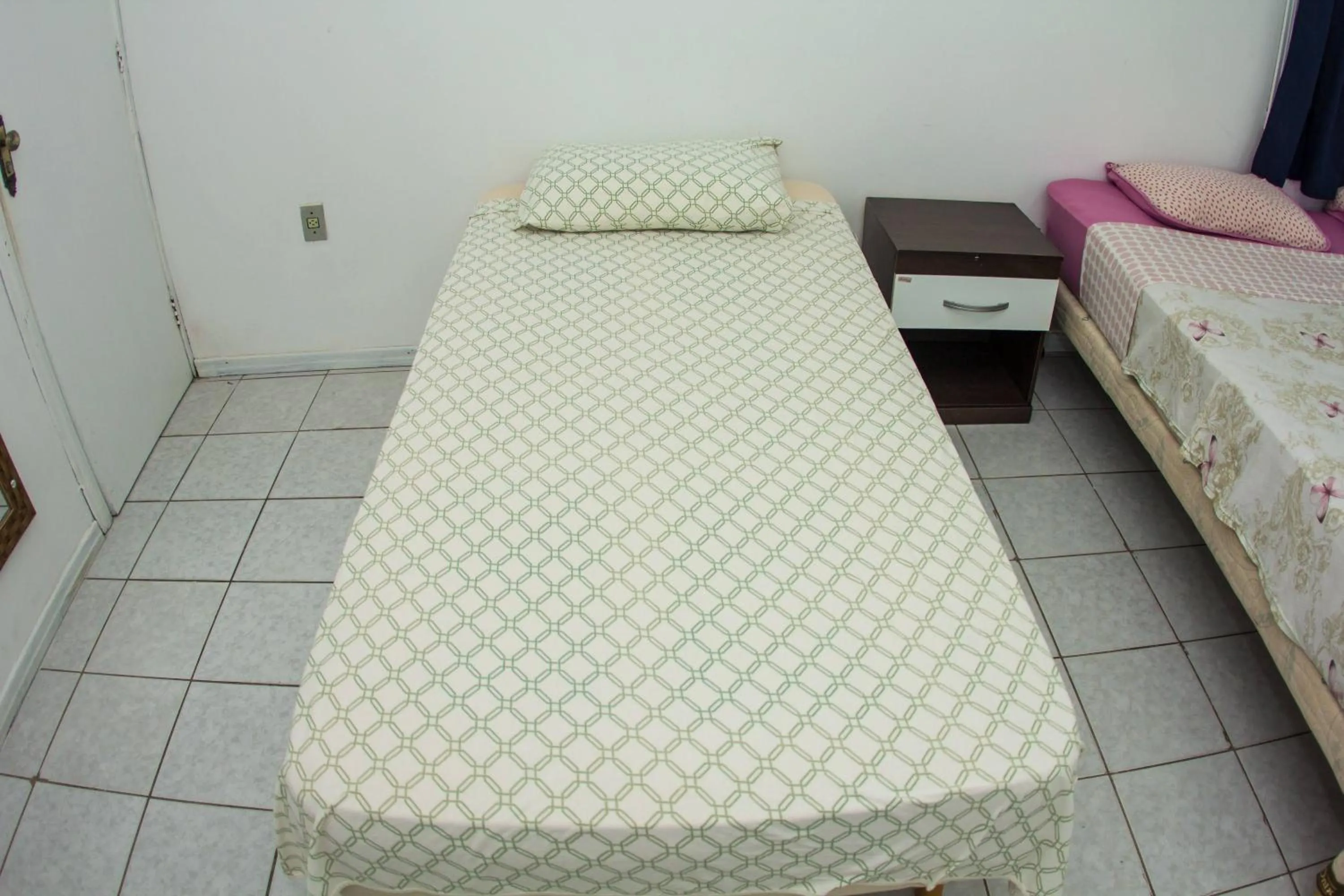 Bed in Hotel Recanto do Mar