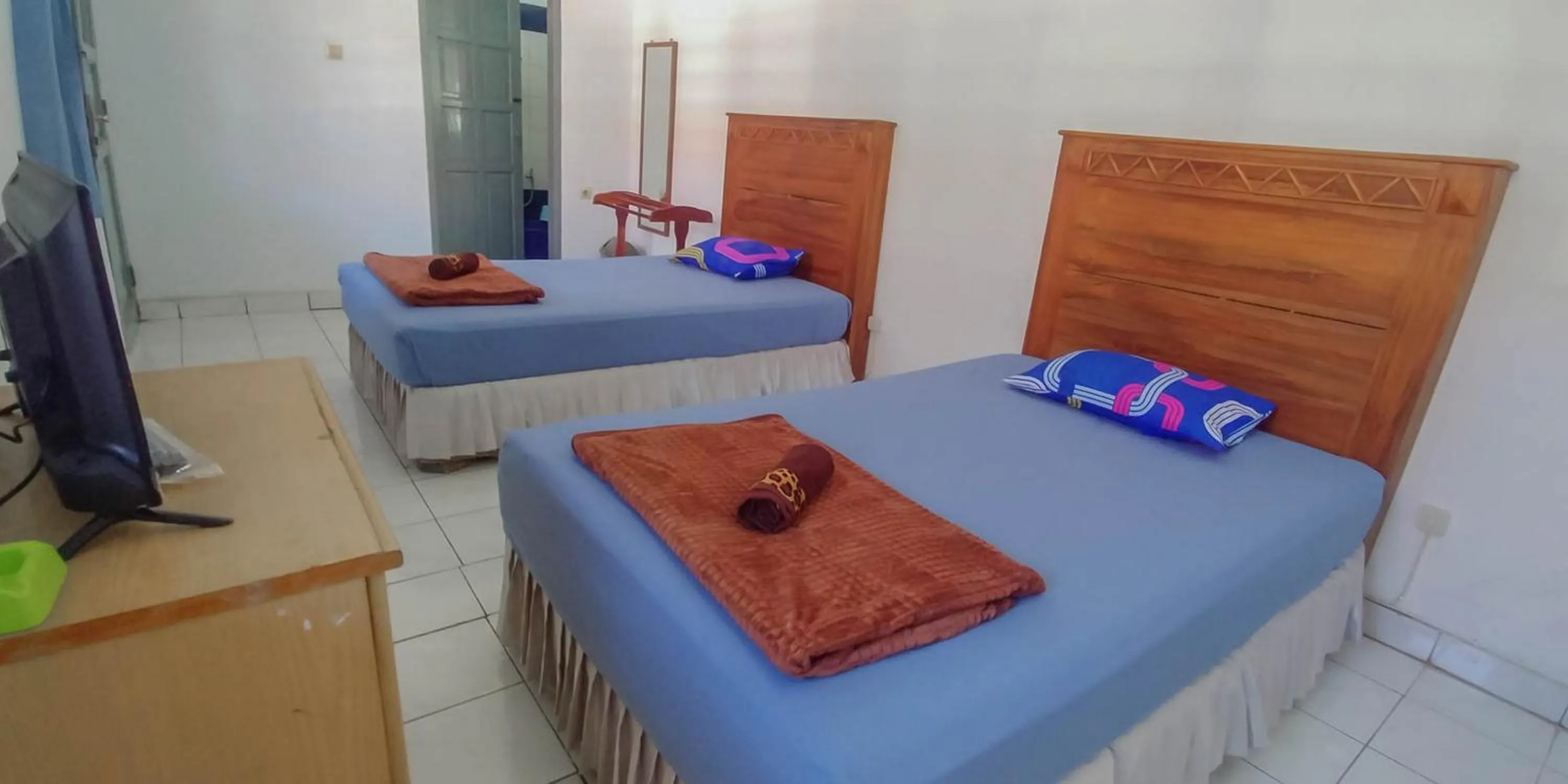 Bed in Hotel Rajawali Mitra RedDoorz