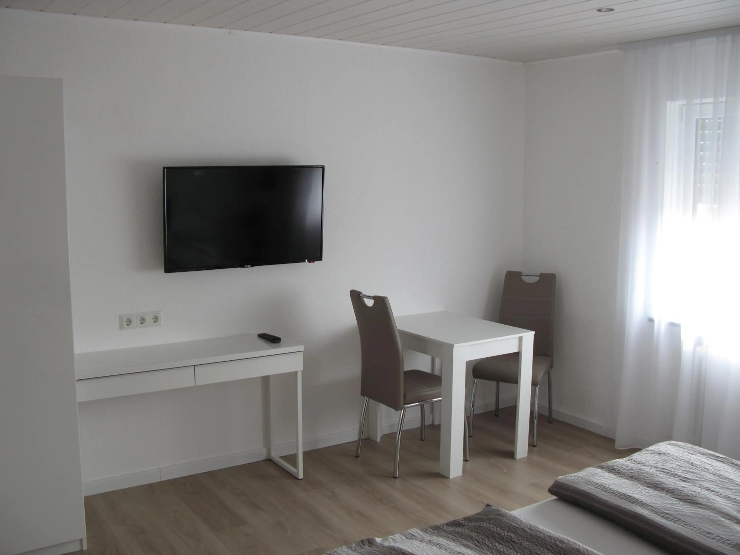 Seating area, Bed in Murgtal Motel