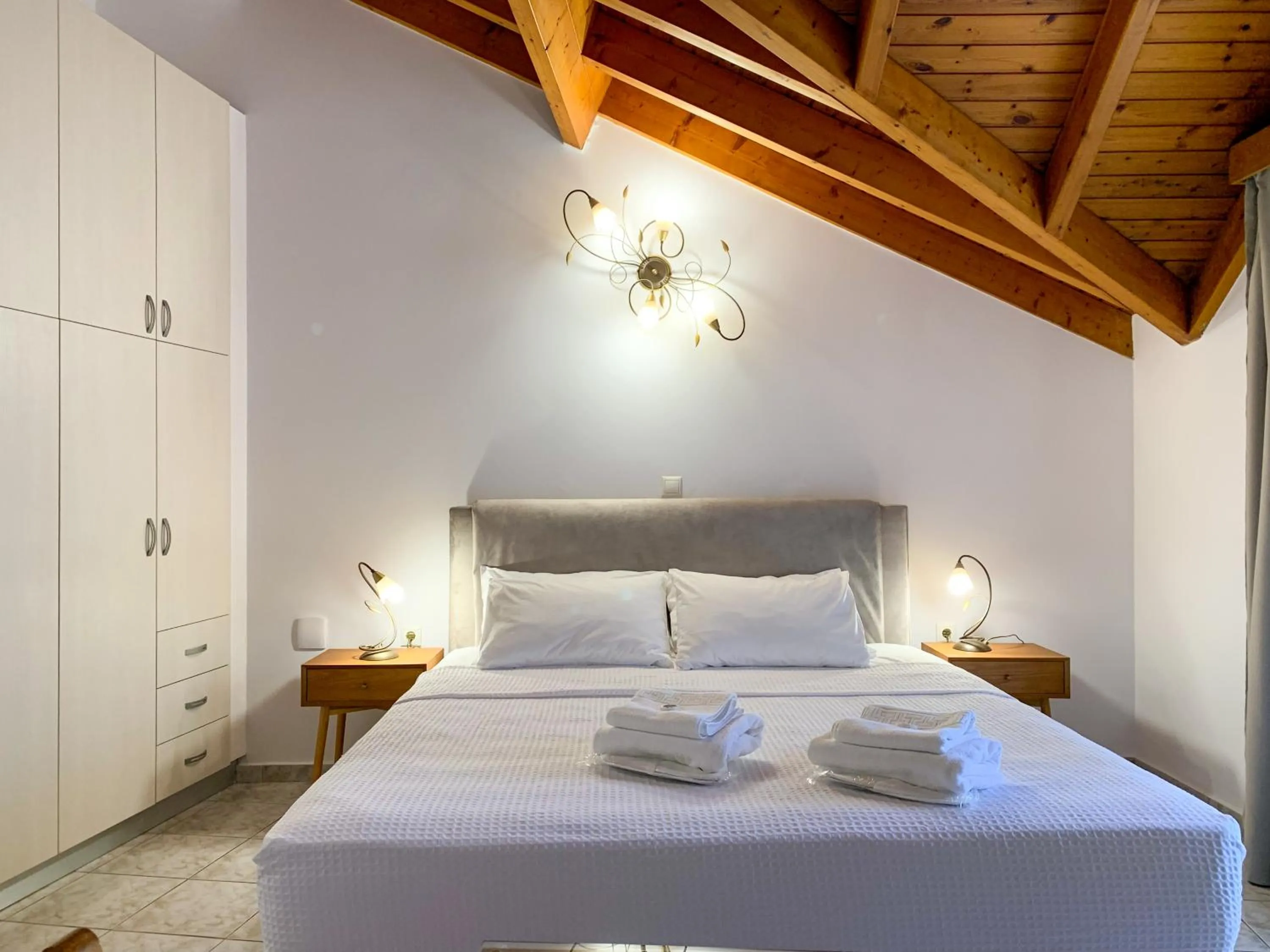 Bed in Rouchotas Apartments