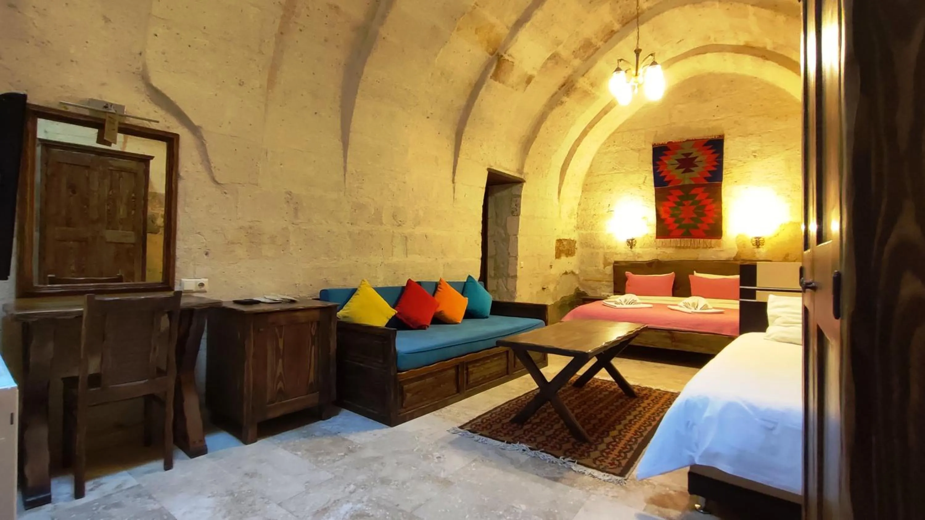 Bed in ARMEsos Cave Hotel