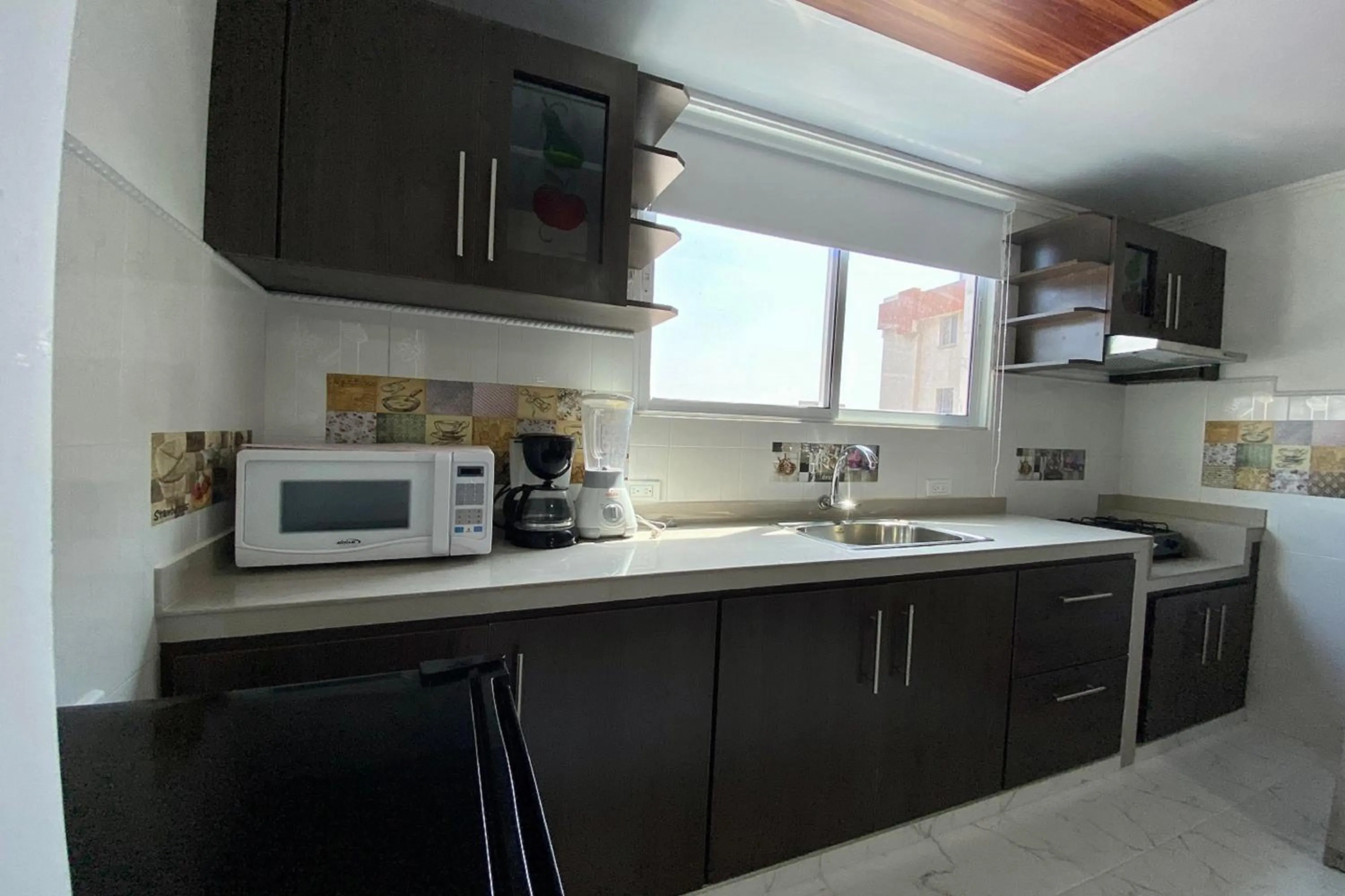Kitchen or kitchenette in Villa Santos Apartaestudios