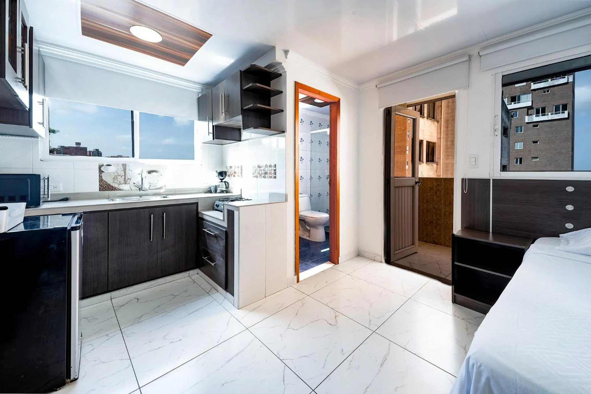 Kitchen or kitchenette, Bed in Villa Santos Apartaestudios