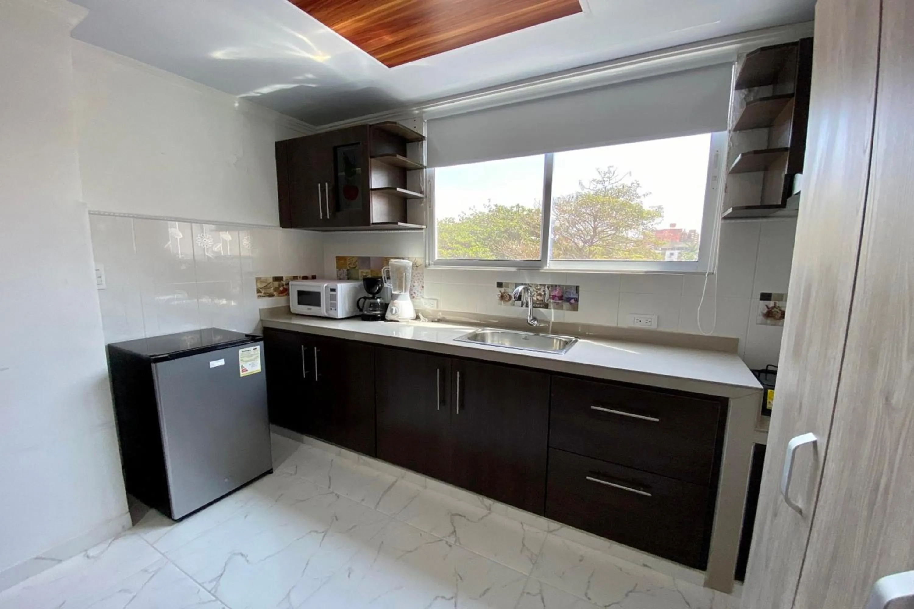 Kitchen or kitchenette in Villa Santos Apartaestudios