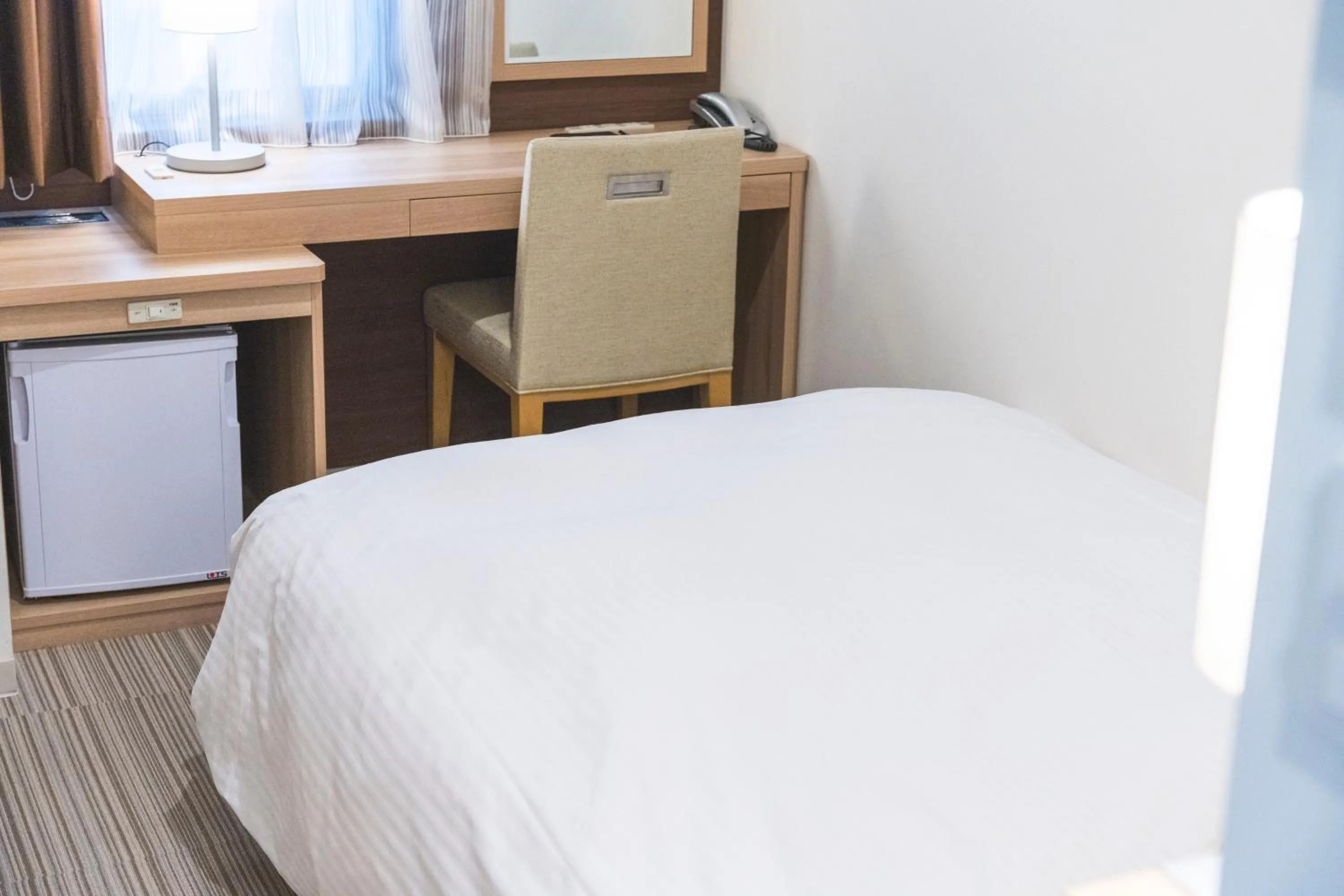 Photo of the whole room, Bed in KOKO HOTEL Hiroshima Ekimae