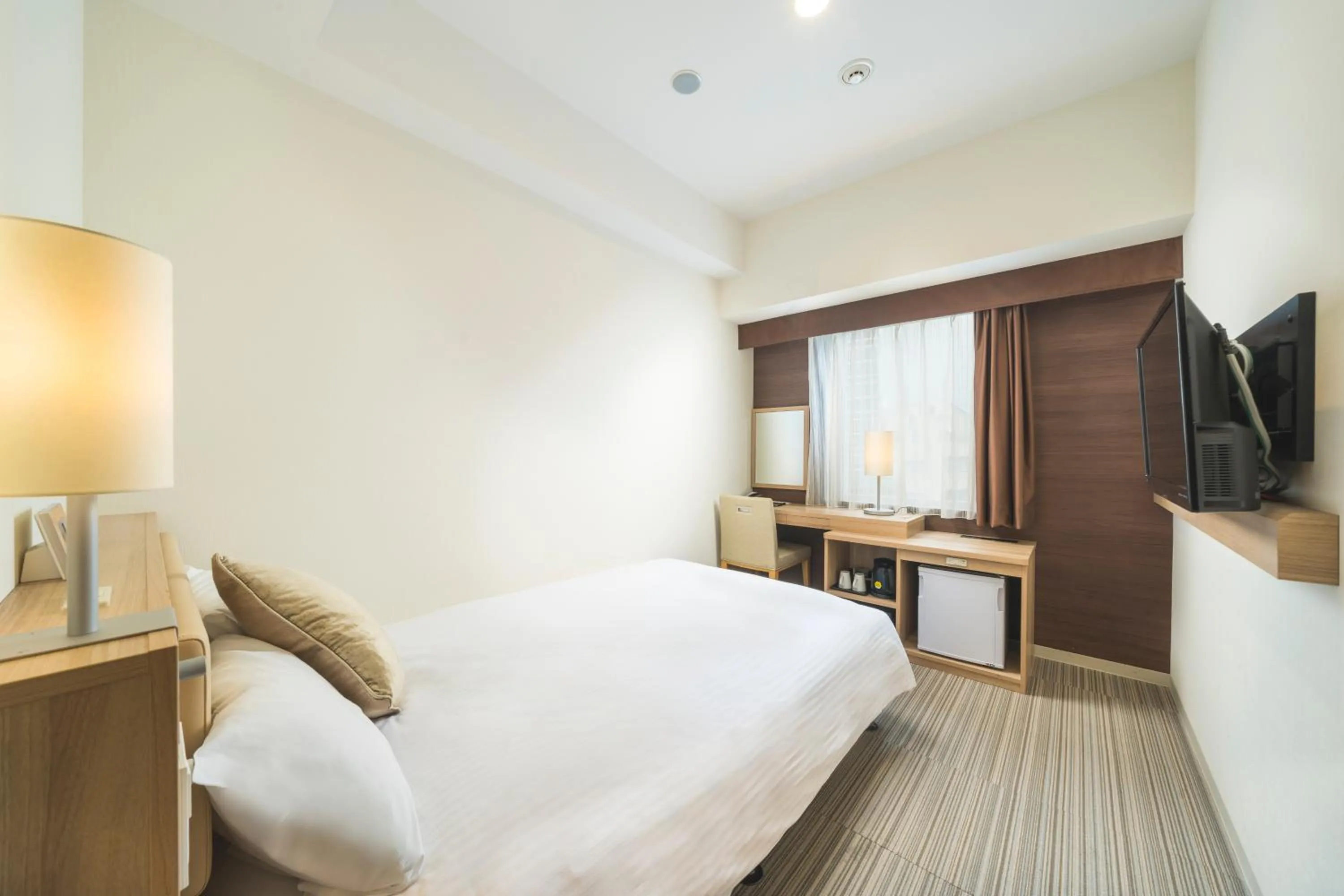 Photo of the whole room, Bed in KOKO HOTEL Hiroshima Ekimae