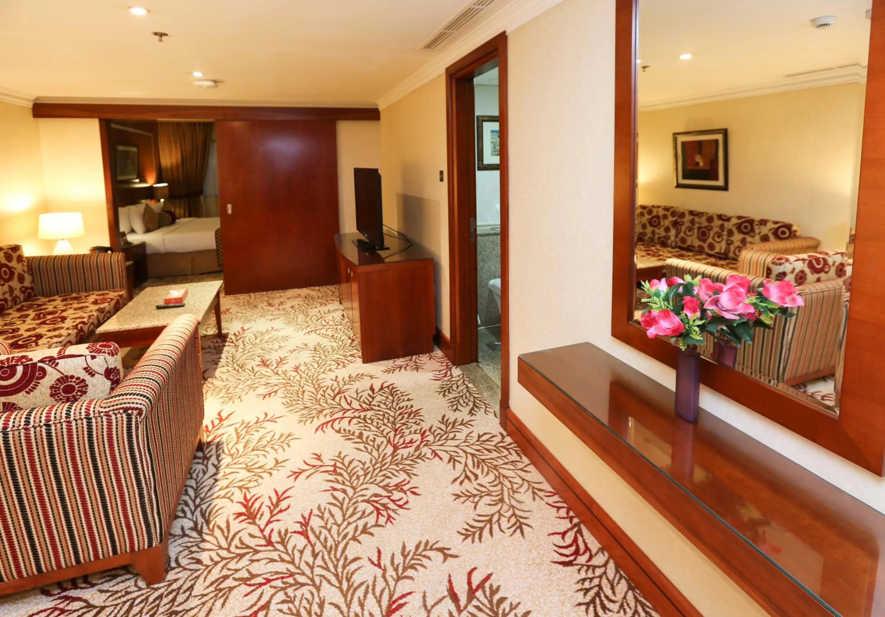 Living room, Bed in Ramee Royal Hotel