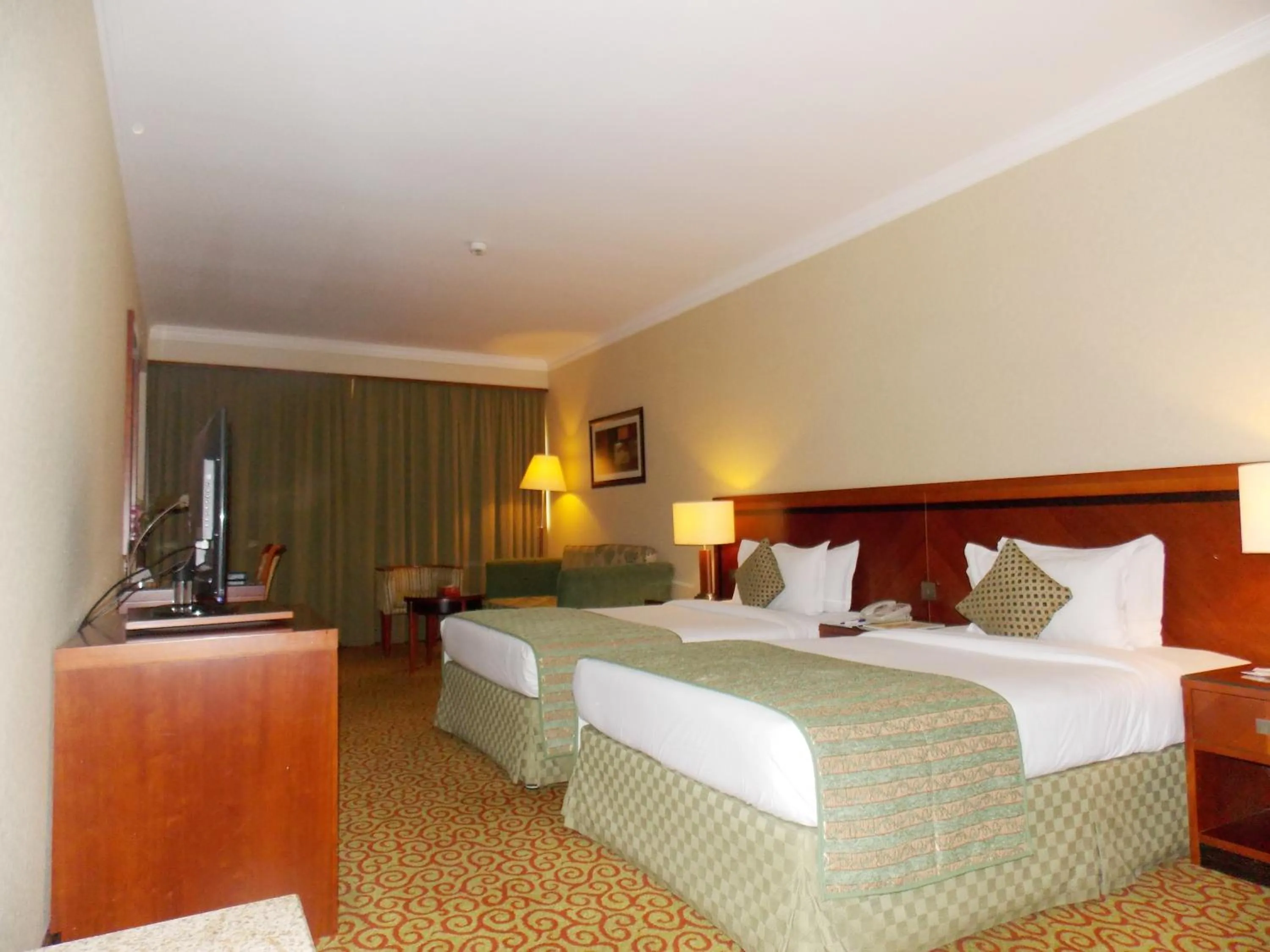 Photo of the whole room, Bed in Ramee Royal Hotel
