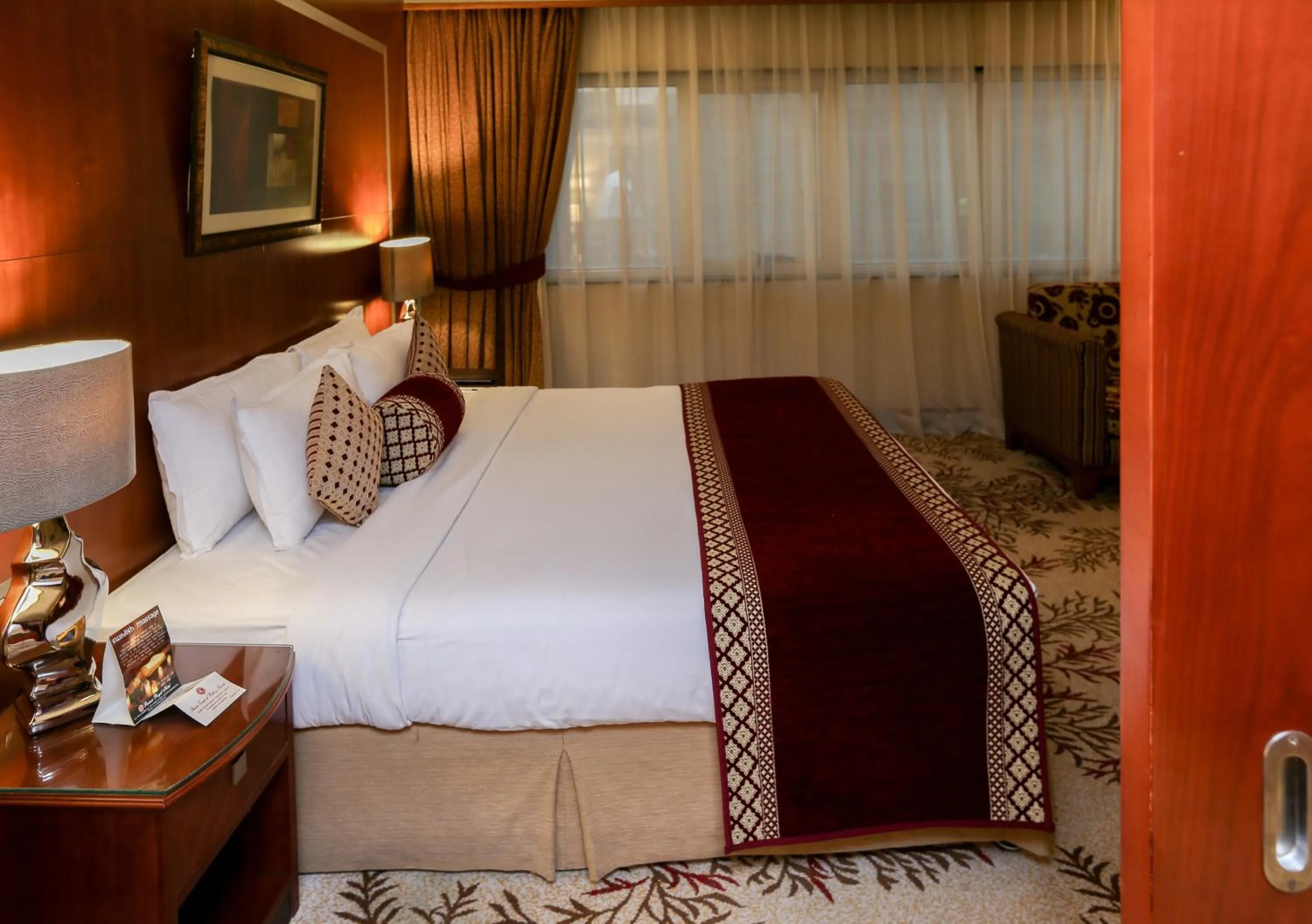 Bed in Ramee Royal Hotel