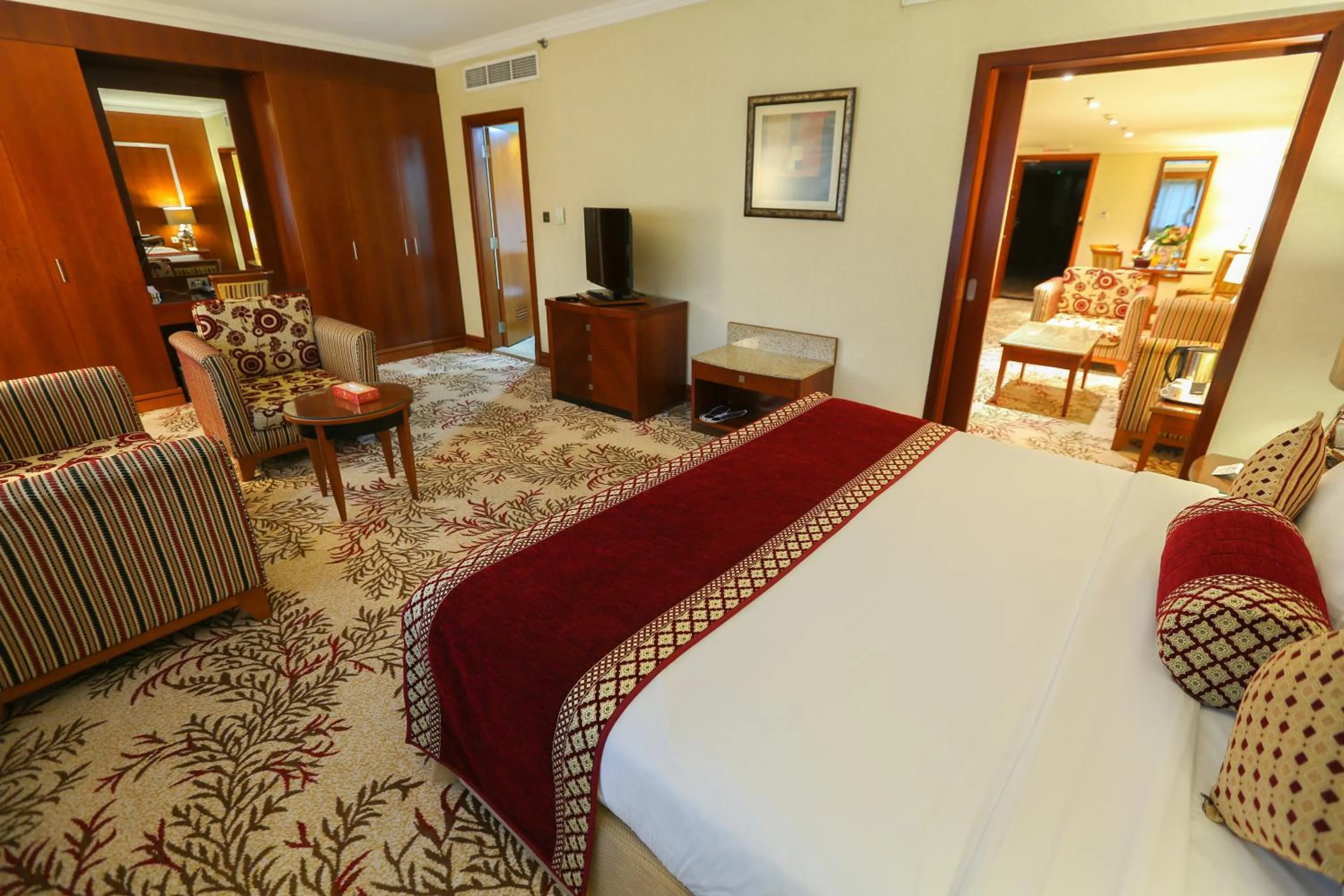 Bed in Ramee Royal Hotel