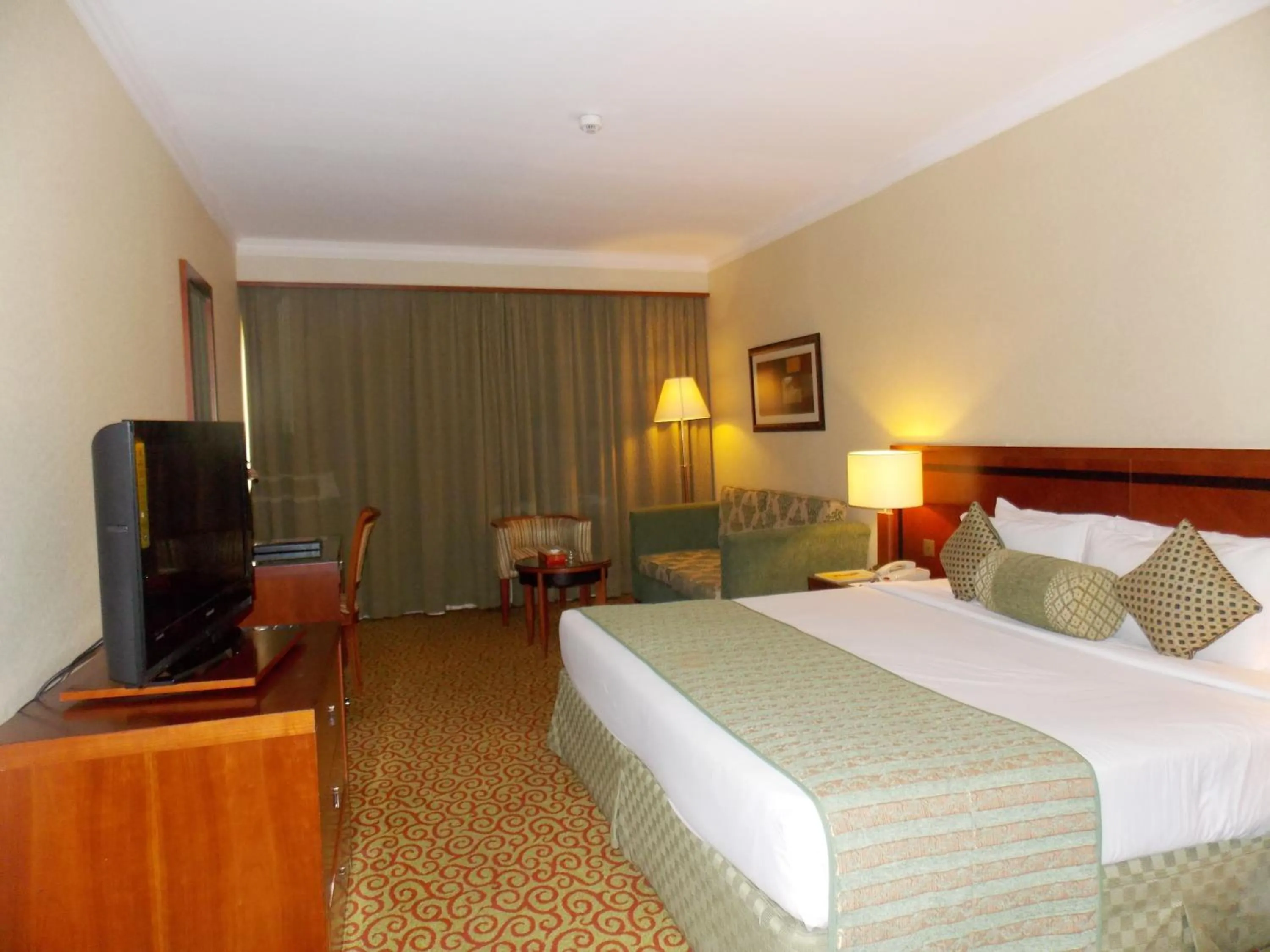 Photo of the whole room, Bed in Ramee Royal Hotel
