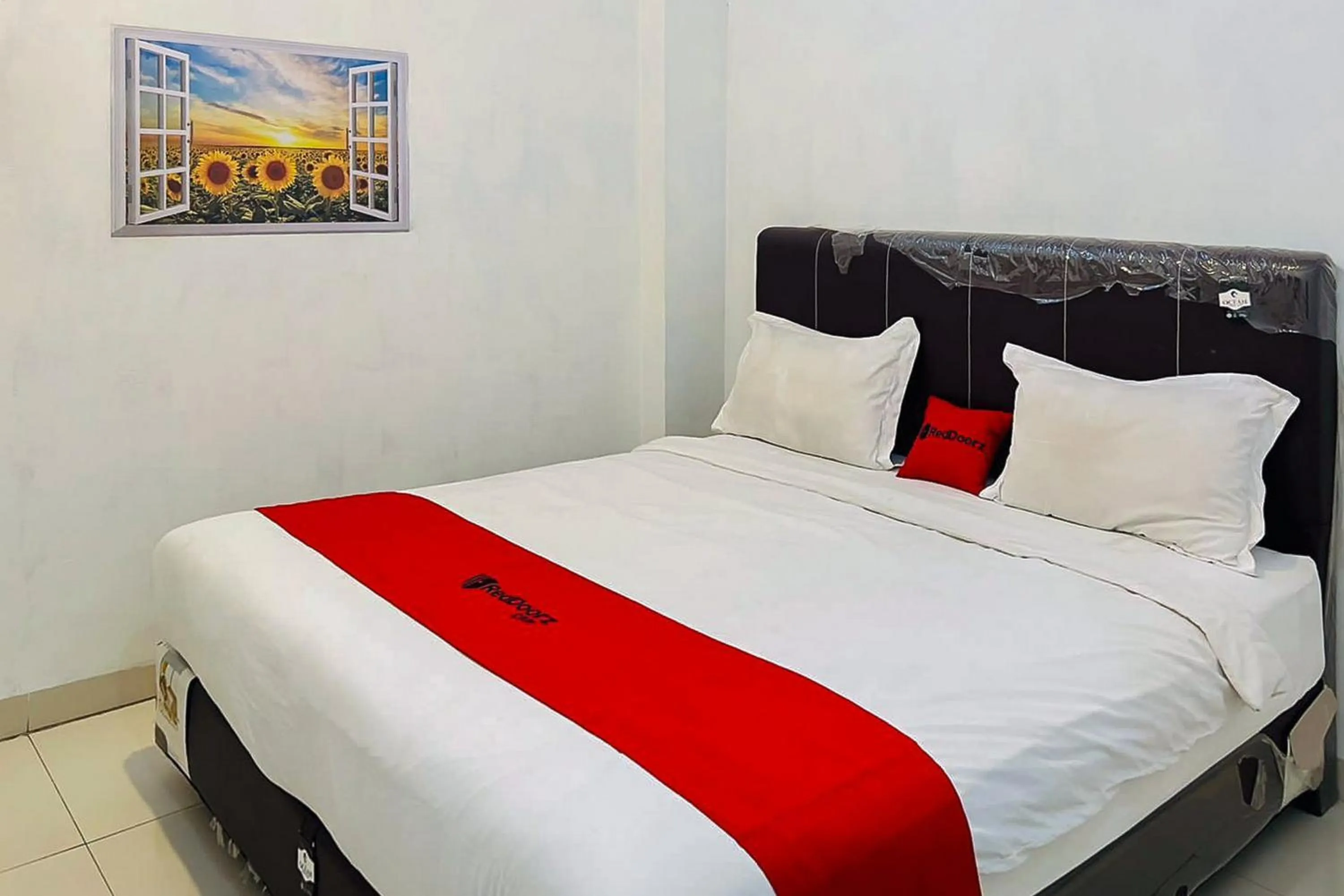 Bed in RedDoorz At Damai Guest House Kabanjahe