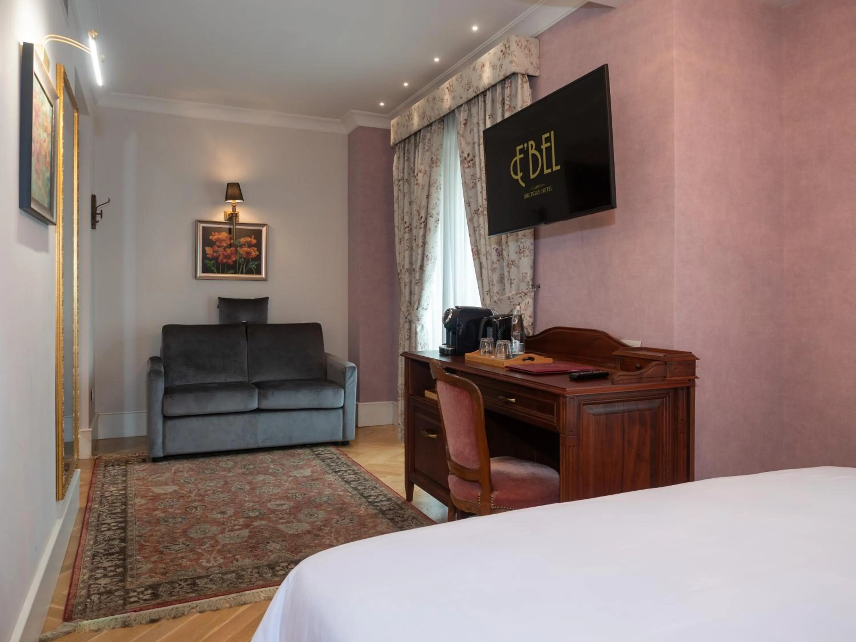 Communal lounge/ TV room, Bed in Ebel Boutique Hotel