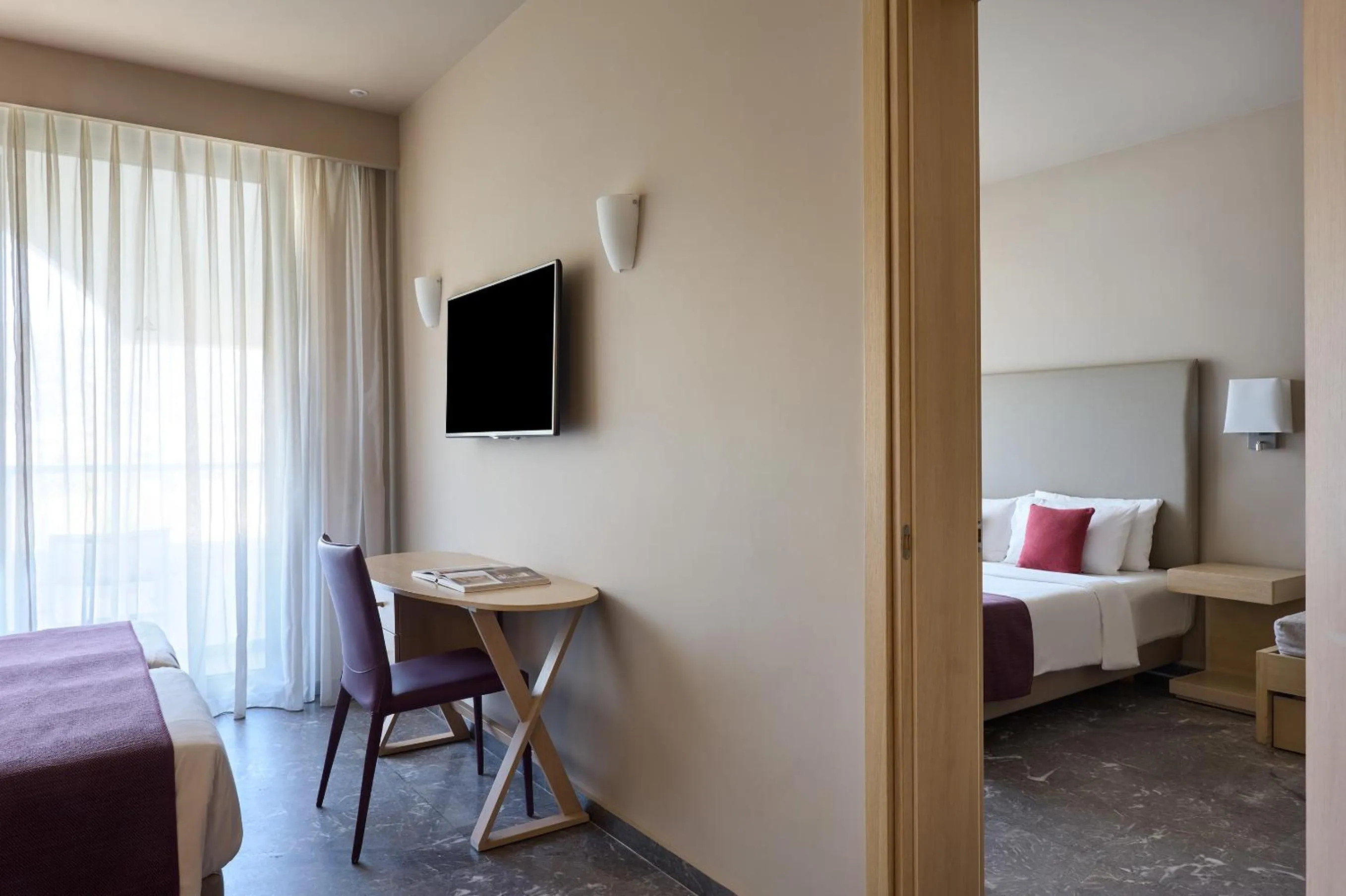 Communal lounge/ TV room, Bed in Atlantica Akti Zeus Hotel