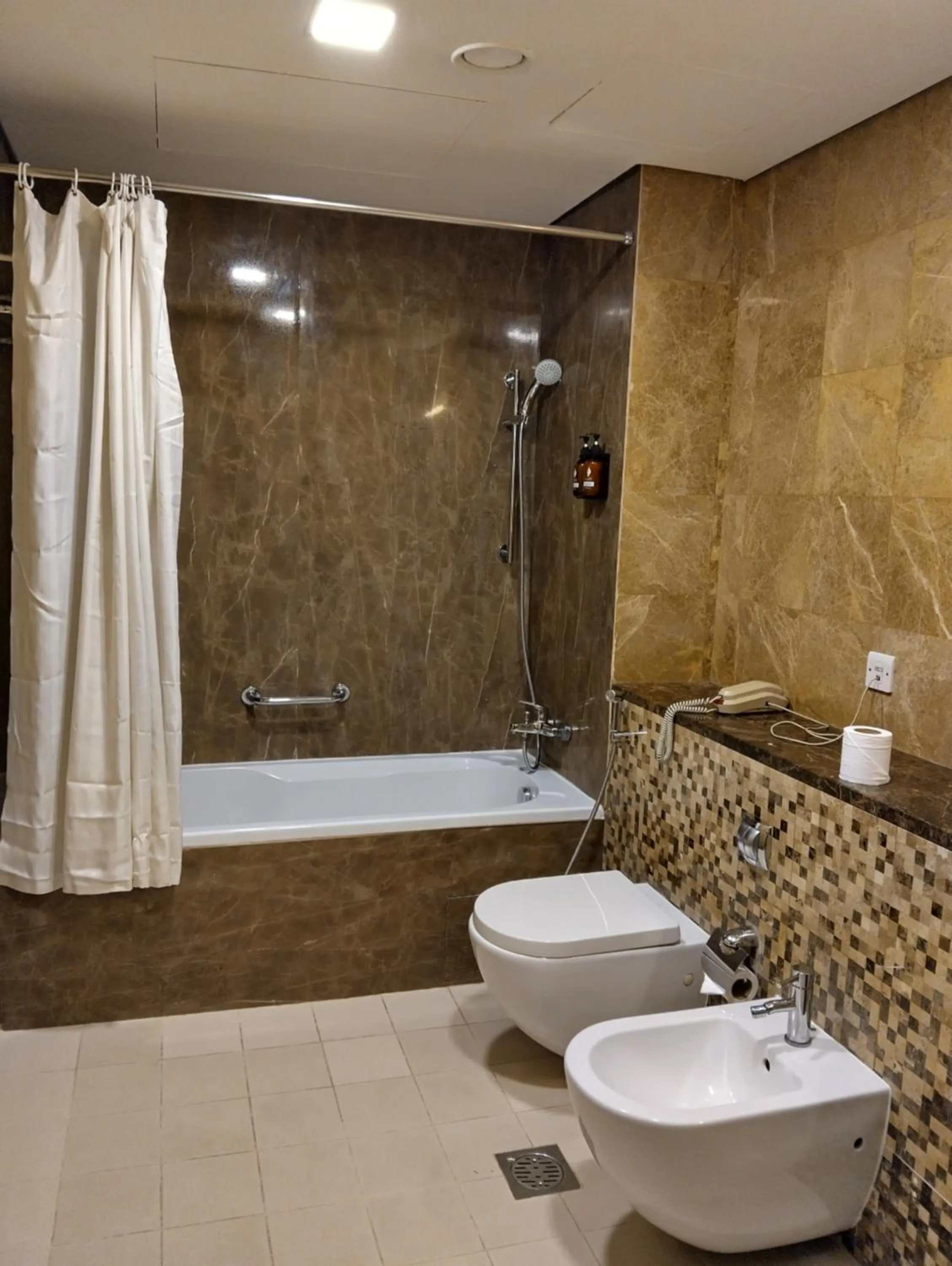 Shower in Tulip Creek Hotel Apartments