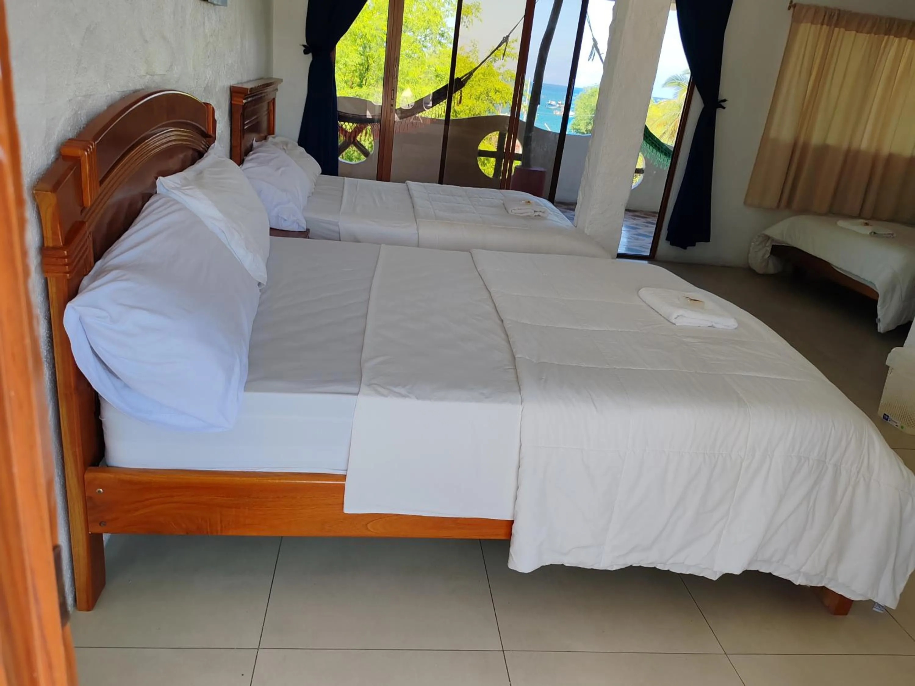 Bed in Royal Galápagos Inn