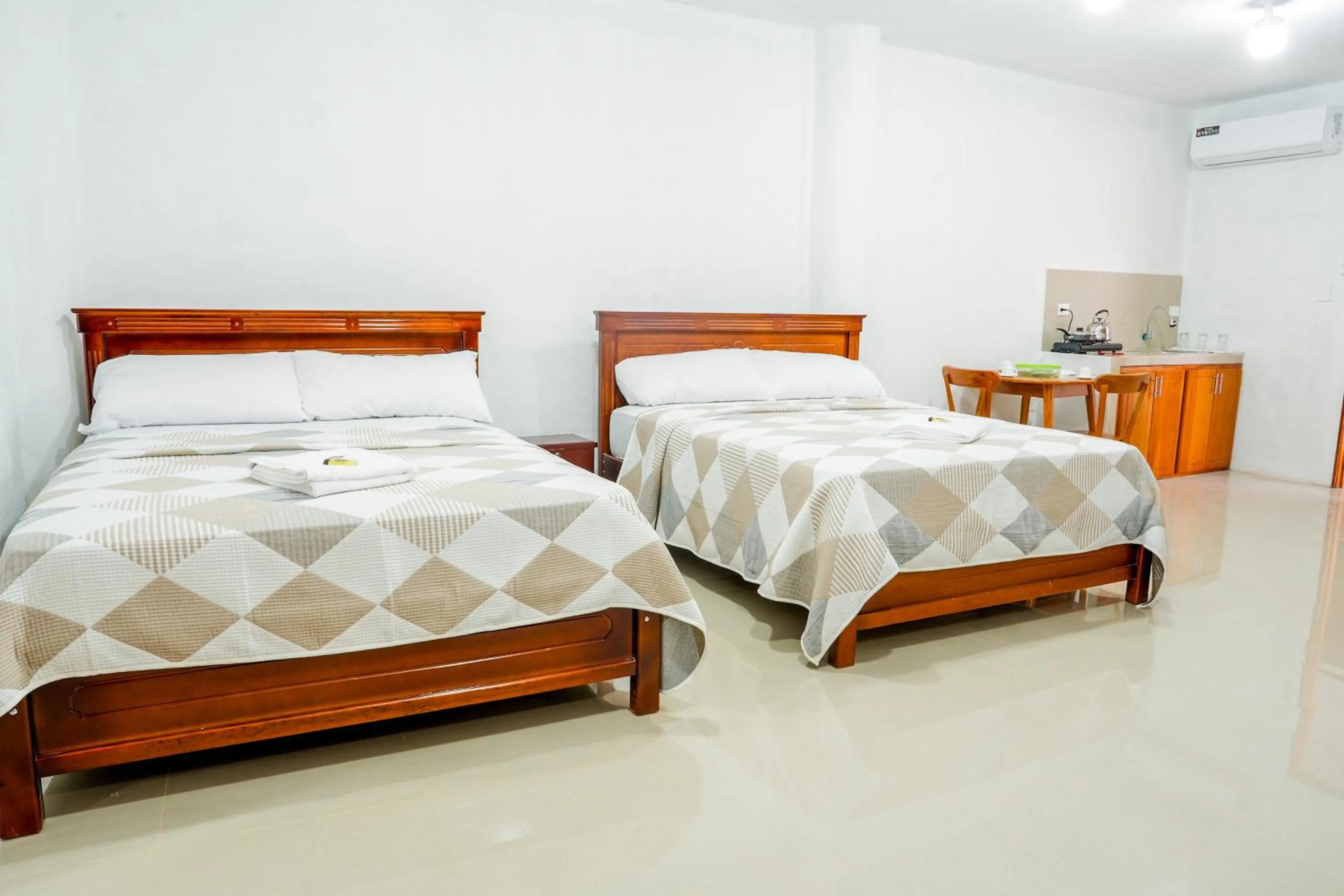 Bed in Royal Galápagos Inn