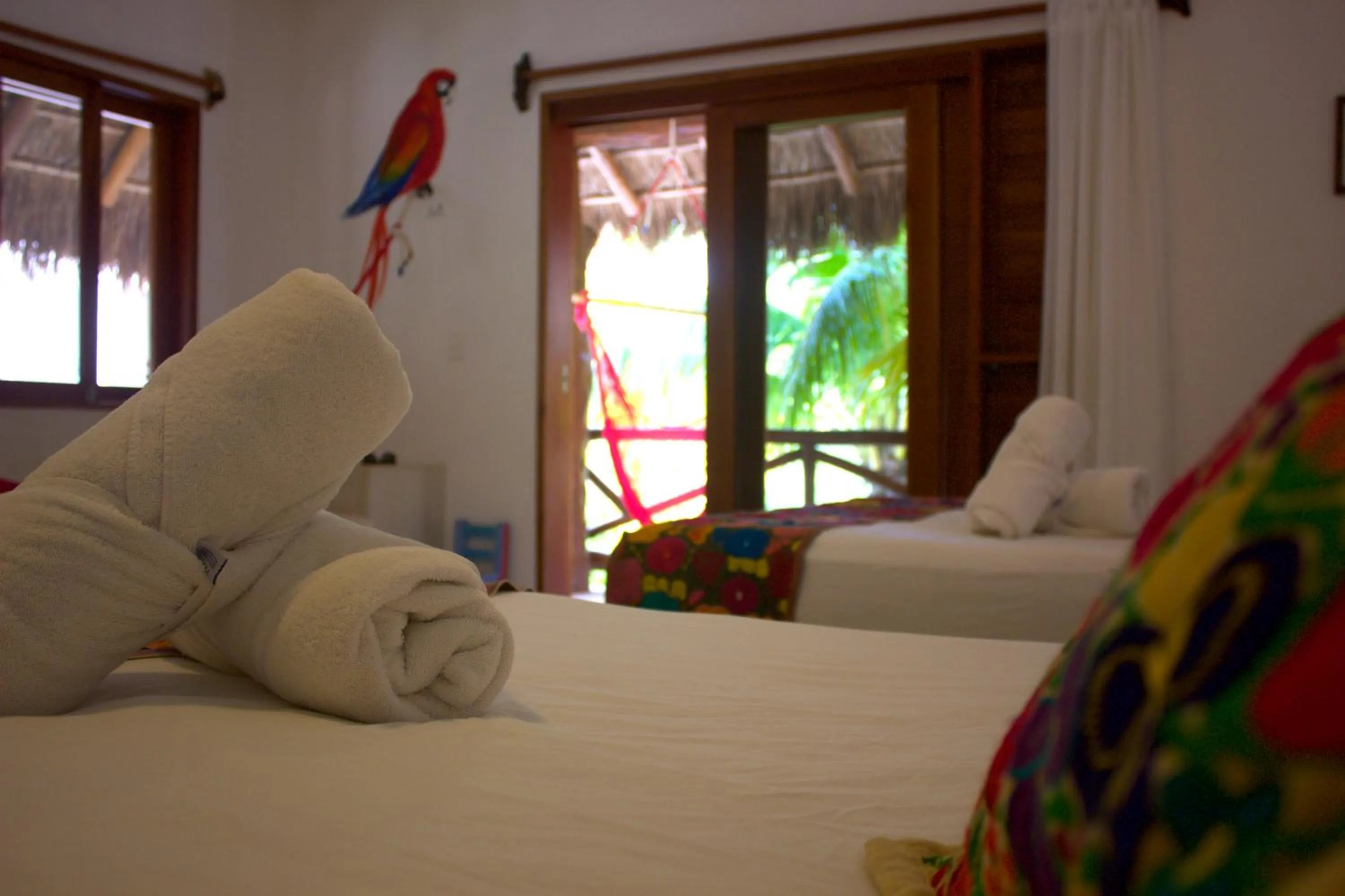 Bed in Casa Iguana Holbox - Beachfront Hotel