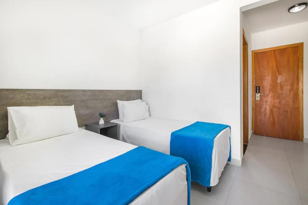 Bed in Hotel Cajueiro Guarujá