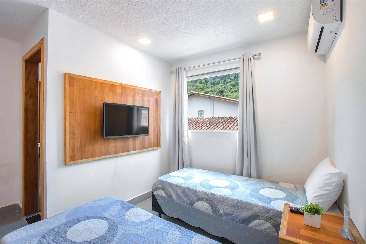 Bed in Hotel Cajueiro Guarujá