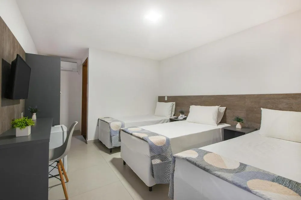 Bed in Hotel Cajueiro Guarujá