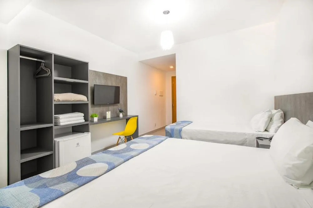 Bed in Hotel Cajueiro Guarujá