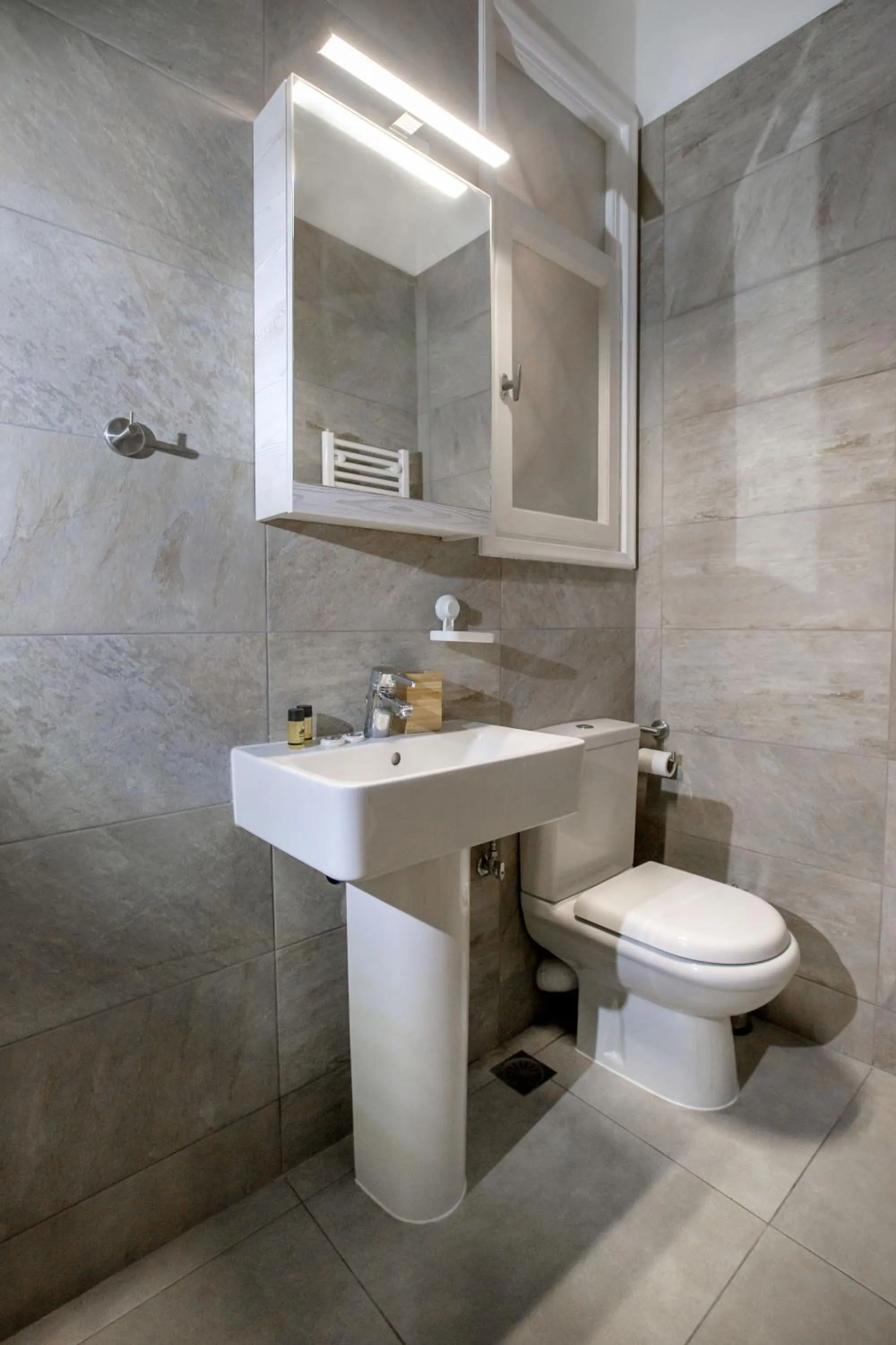 Bathroom in Isora Apartment by GHH