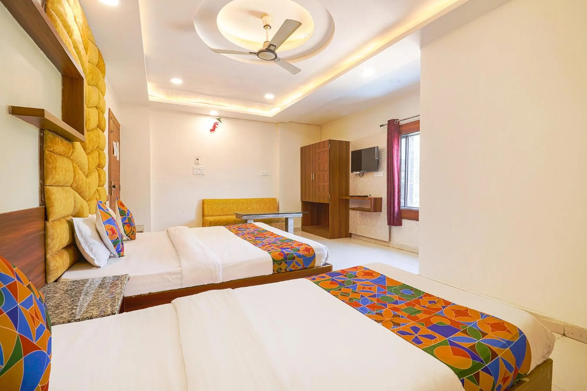 Bed in FabHotel Royal Aanandam