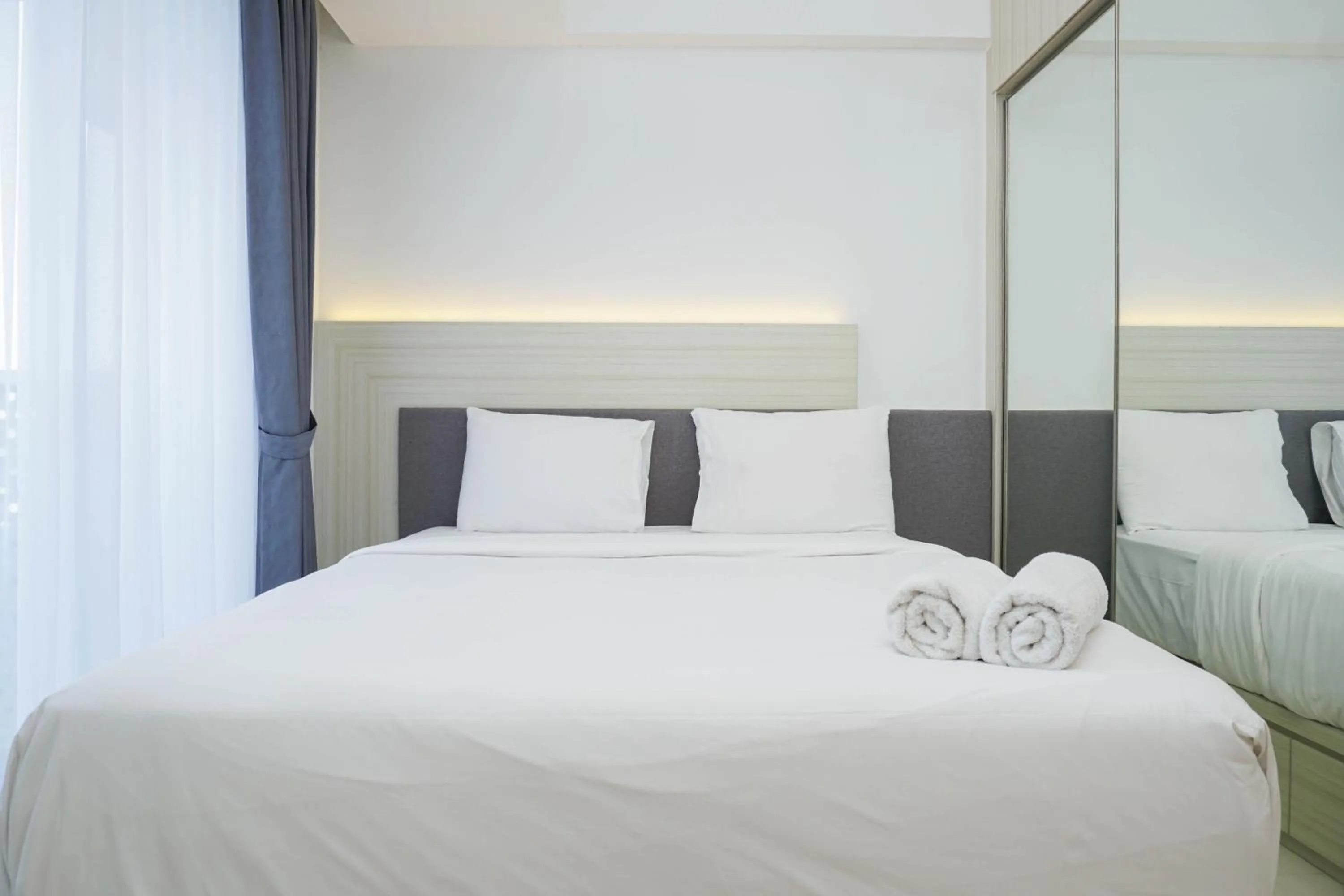 Bed in Relax and Comfy with Pool View at Studio West Vista Apartment By Travelio