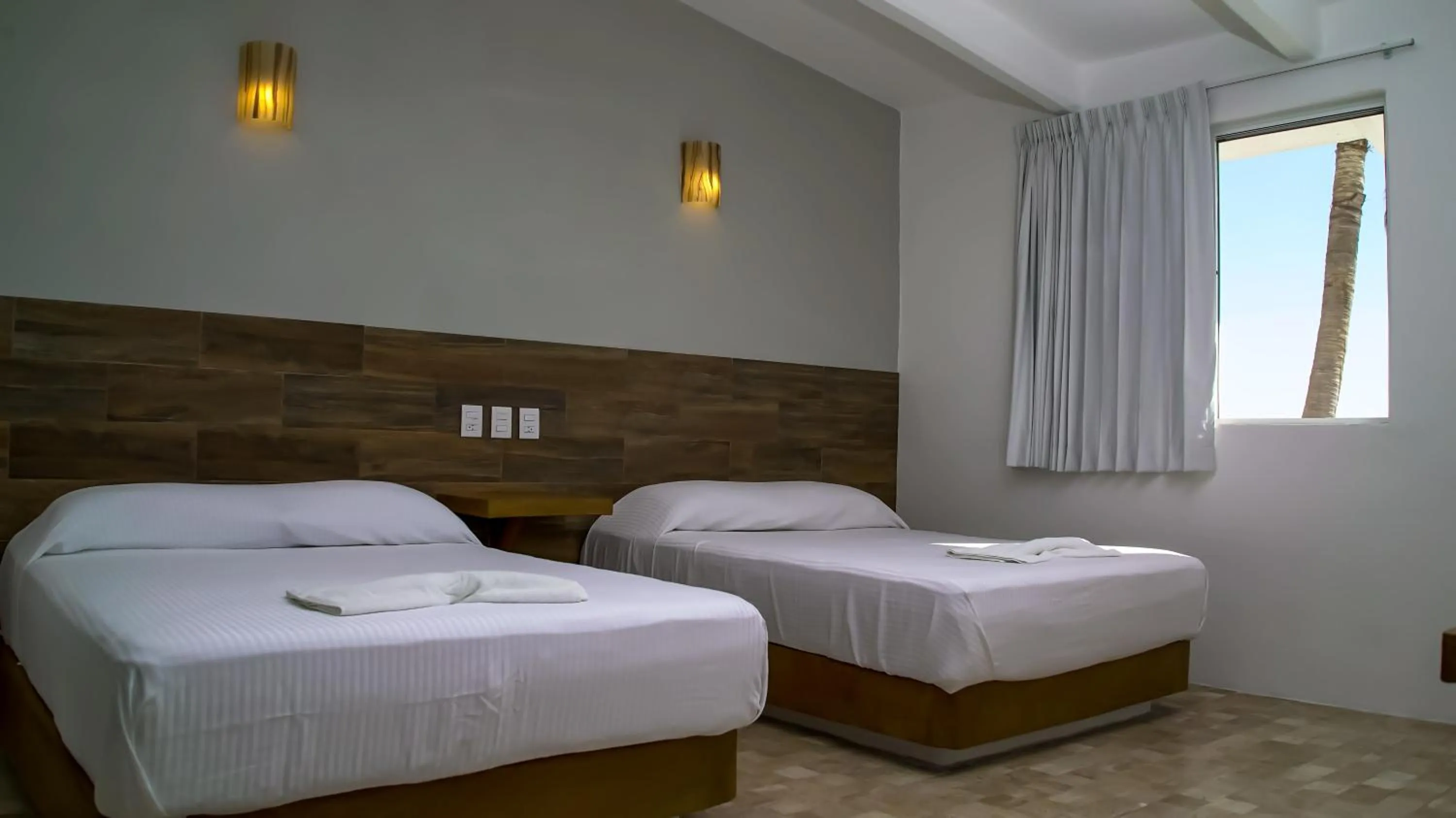 Bed in Hotel Villa Mexicana Puerto Escondido