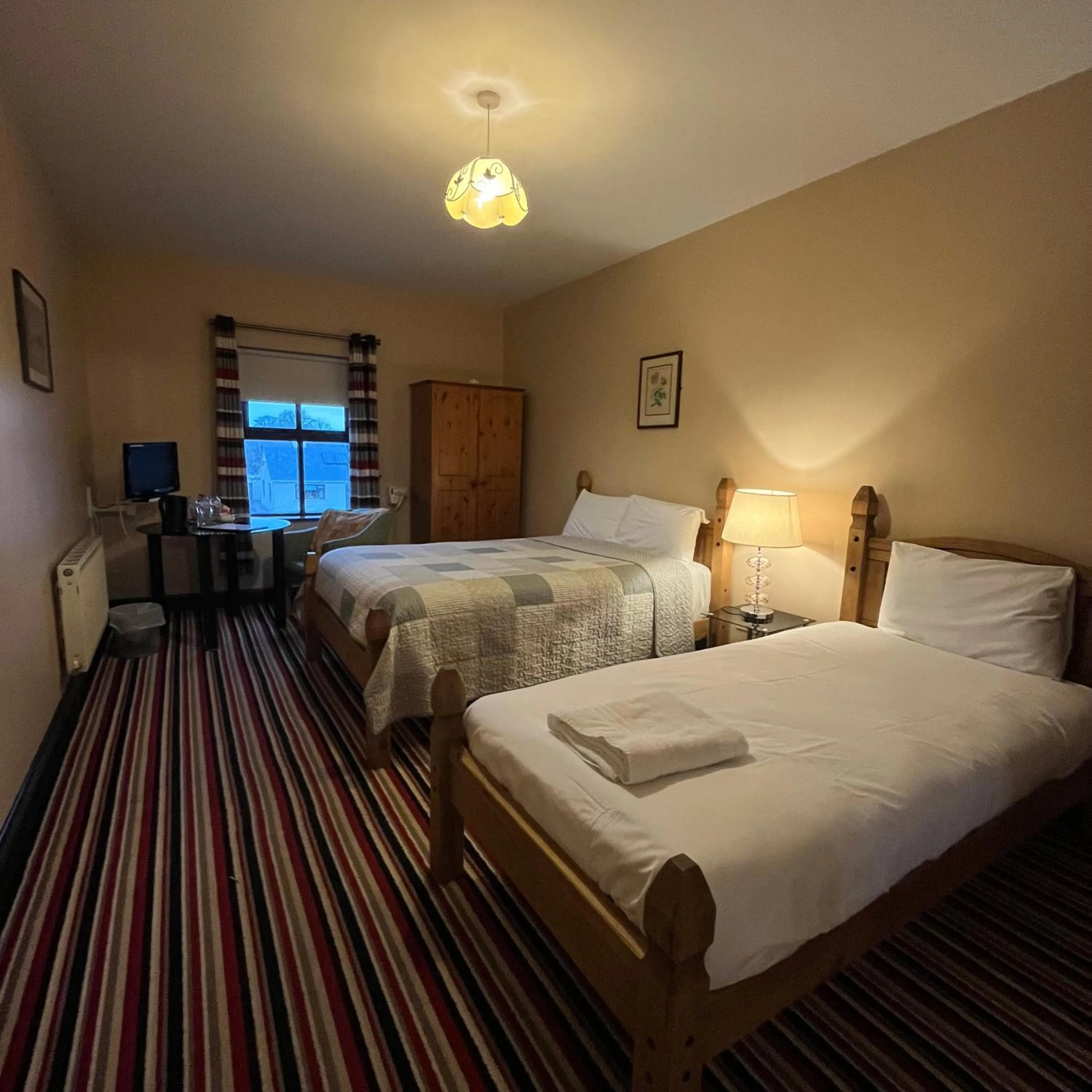 Bed in The Yeats County Inn Hotel