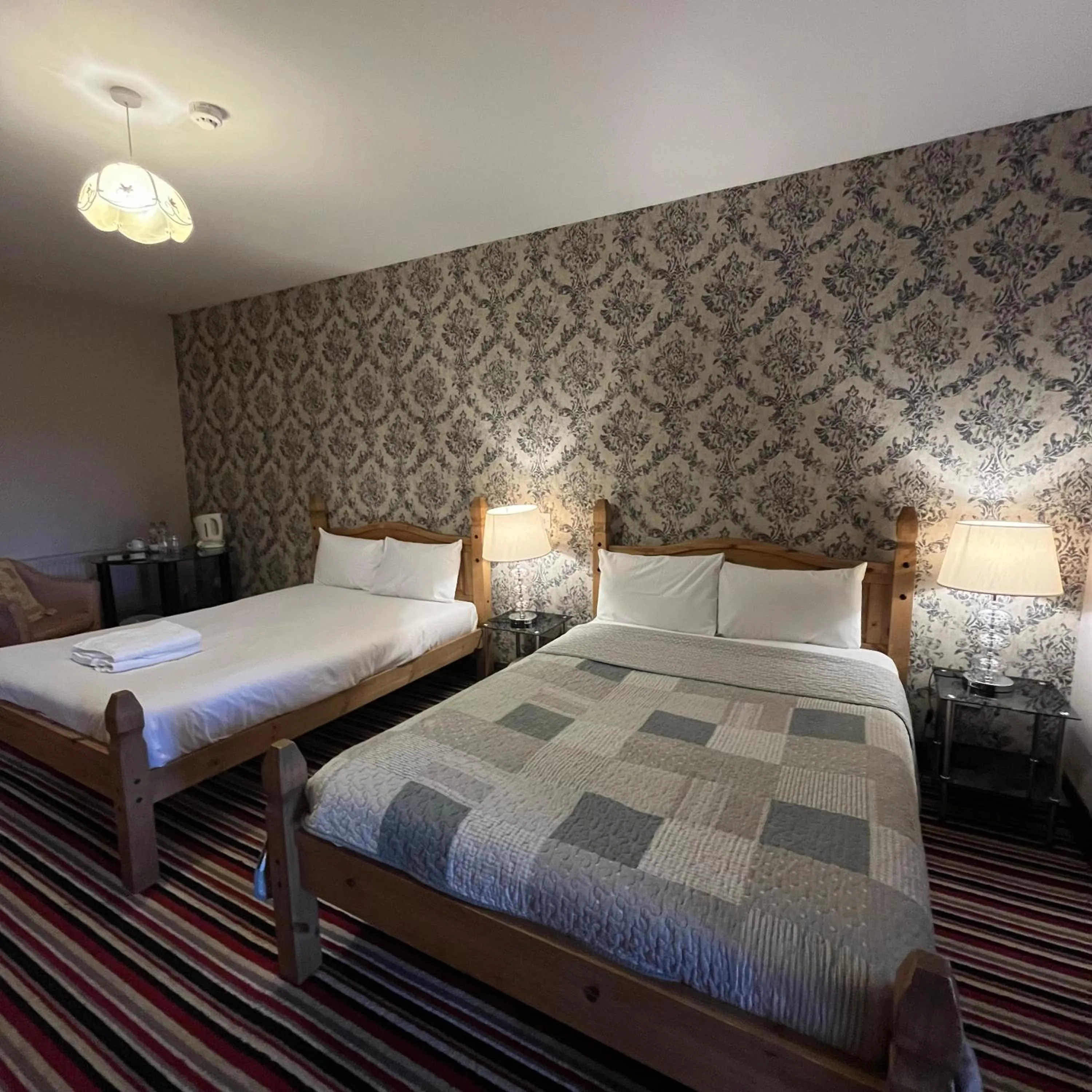 Bed in The Yeats County Inn Hotel