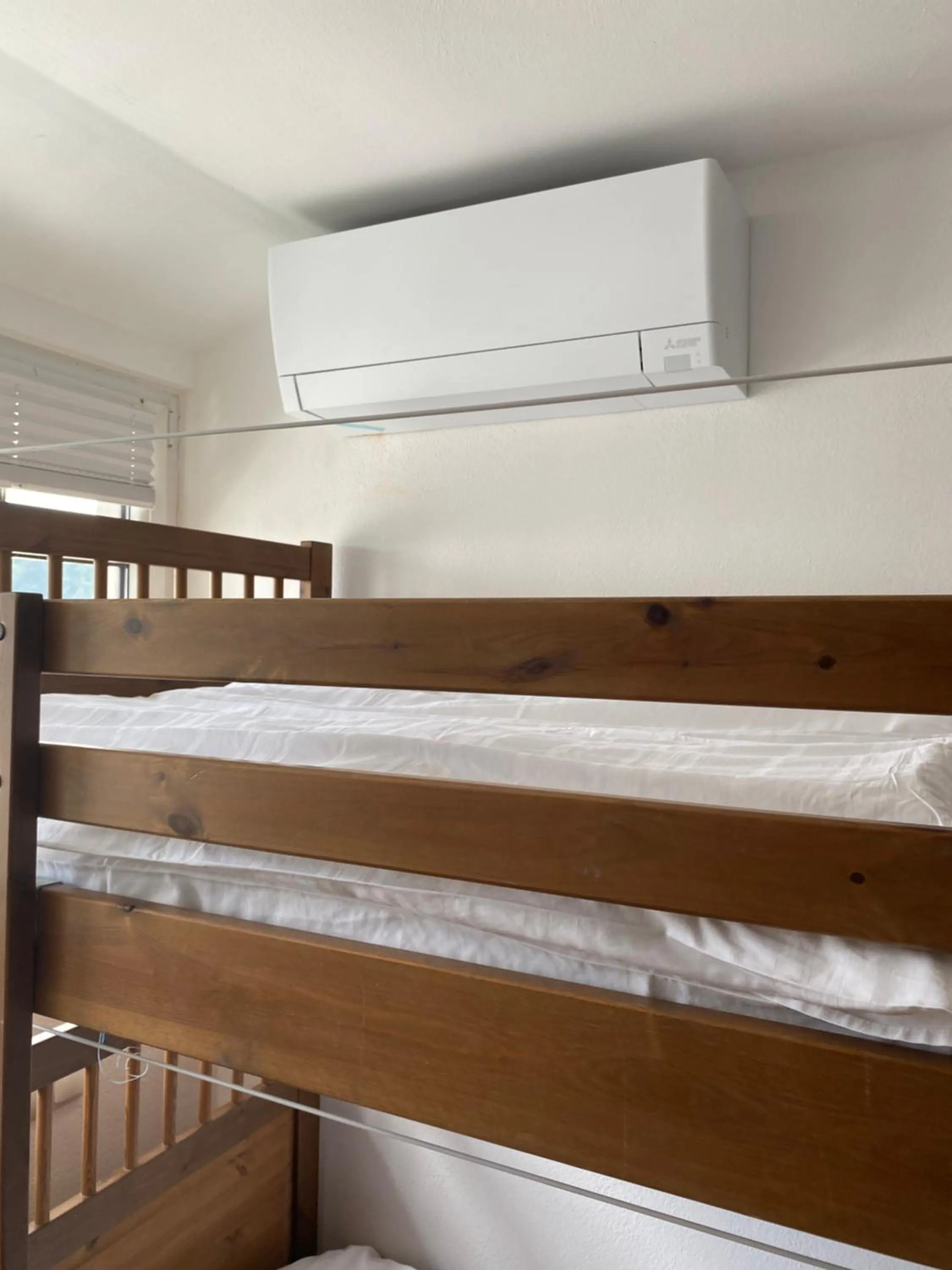 air conditioner, Bed in Travellers' Haven Hostel