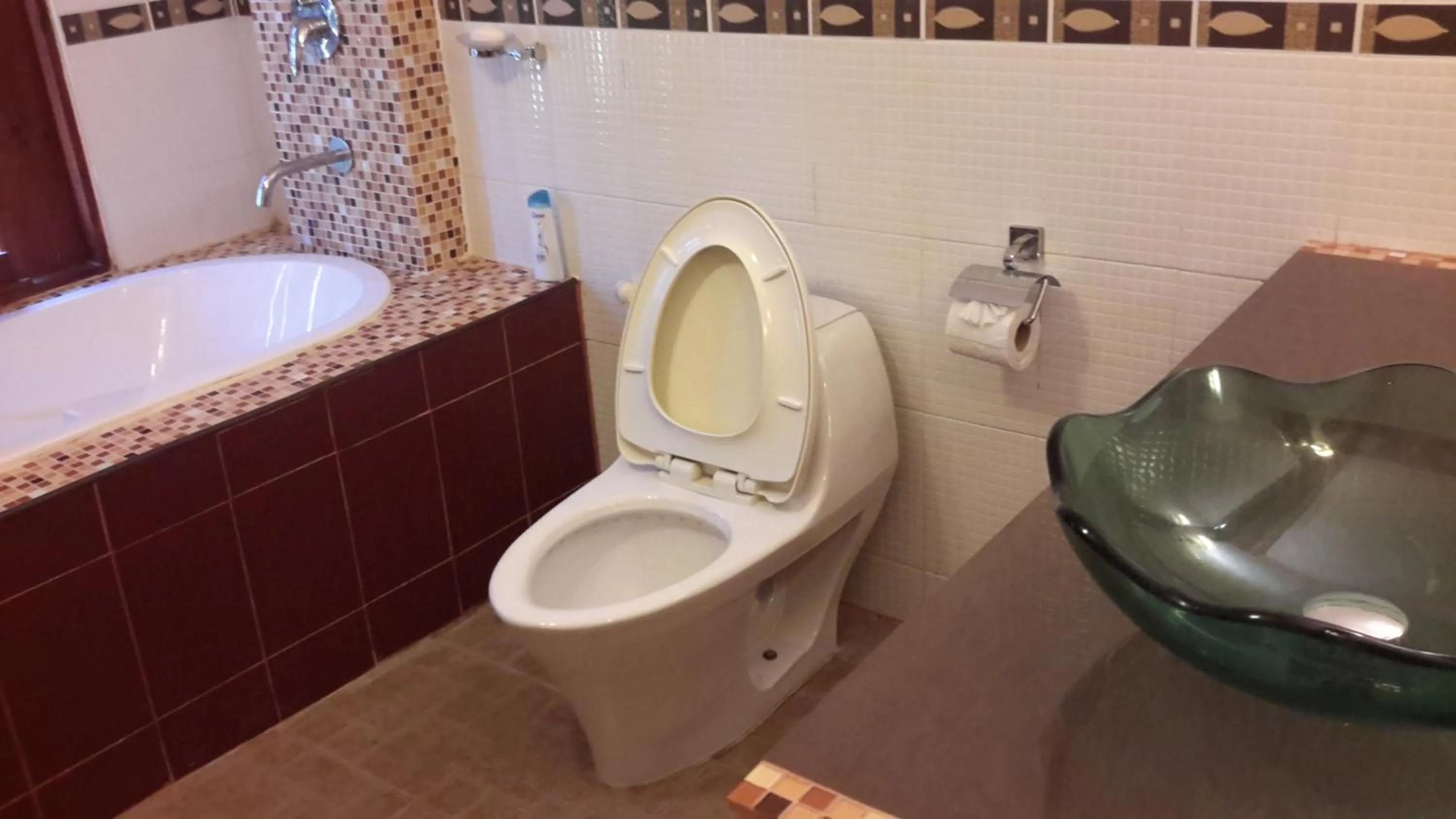 Toilet in Nokkamin Home Chiang Dao