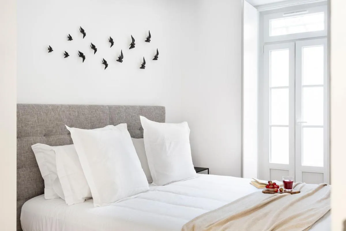 Decorative detail, Bed in FLH Vila Rosário Cosy Flat II