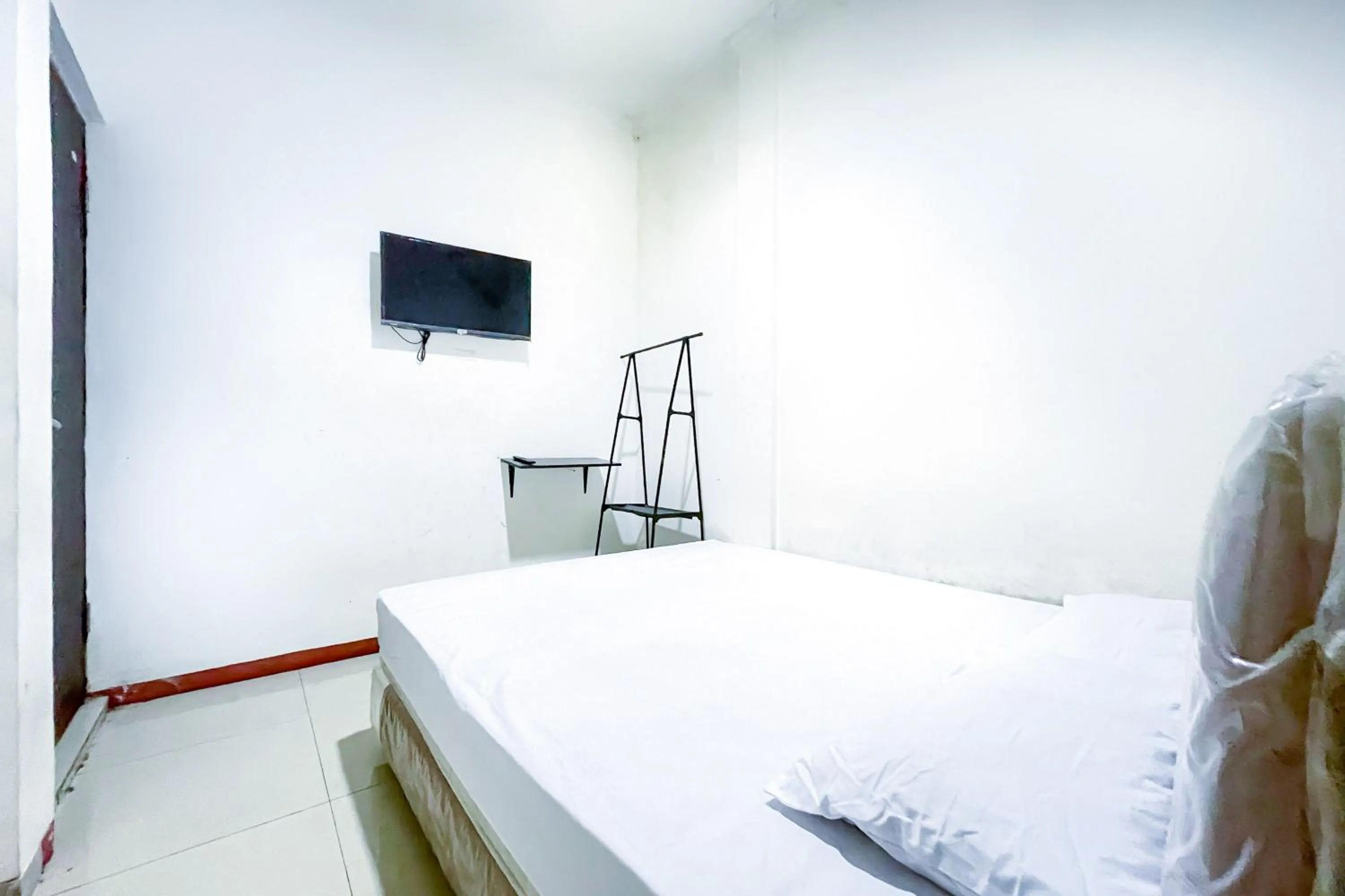 Bed in Citara Jaya Guesthouse Mitra RedDoorz